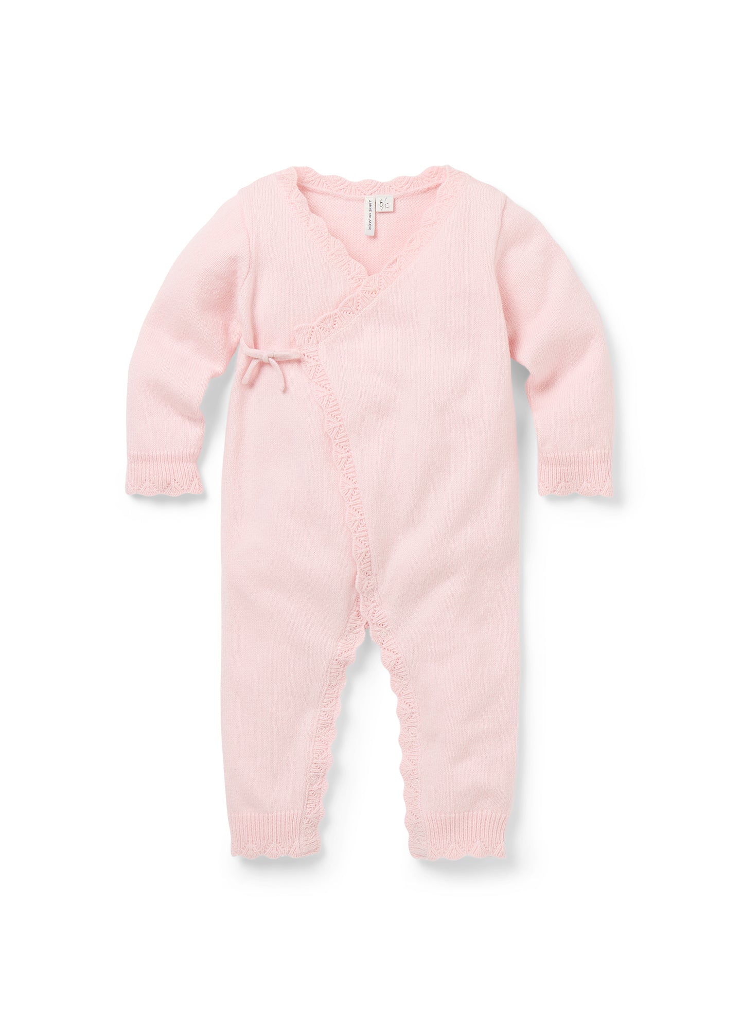 Soft pink knit kimono onesie with long sleeves, wrap front, and side tie closure designed for maternity.