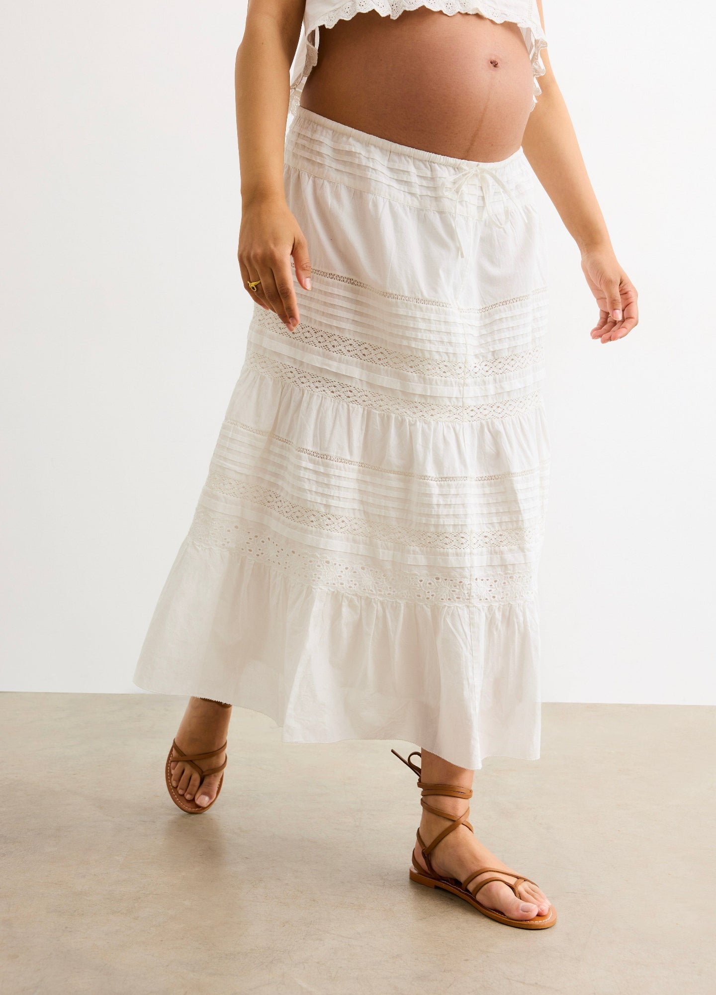 The Ada Skirt - White flowy maternity skirt with tiered lace details, designed for pregnancy, nursing, and postpartum comfort.