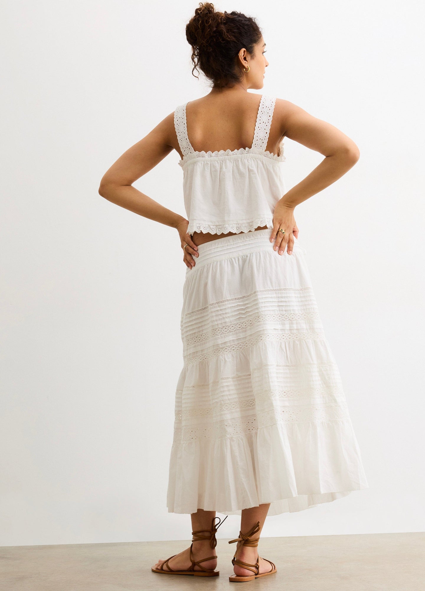 The Ada Skirt - White flowy maternity skirt with tiered lace details, designed for pregnancy, nursing, and postpartum comfort.