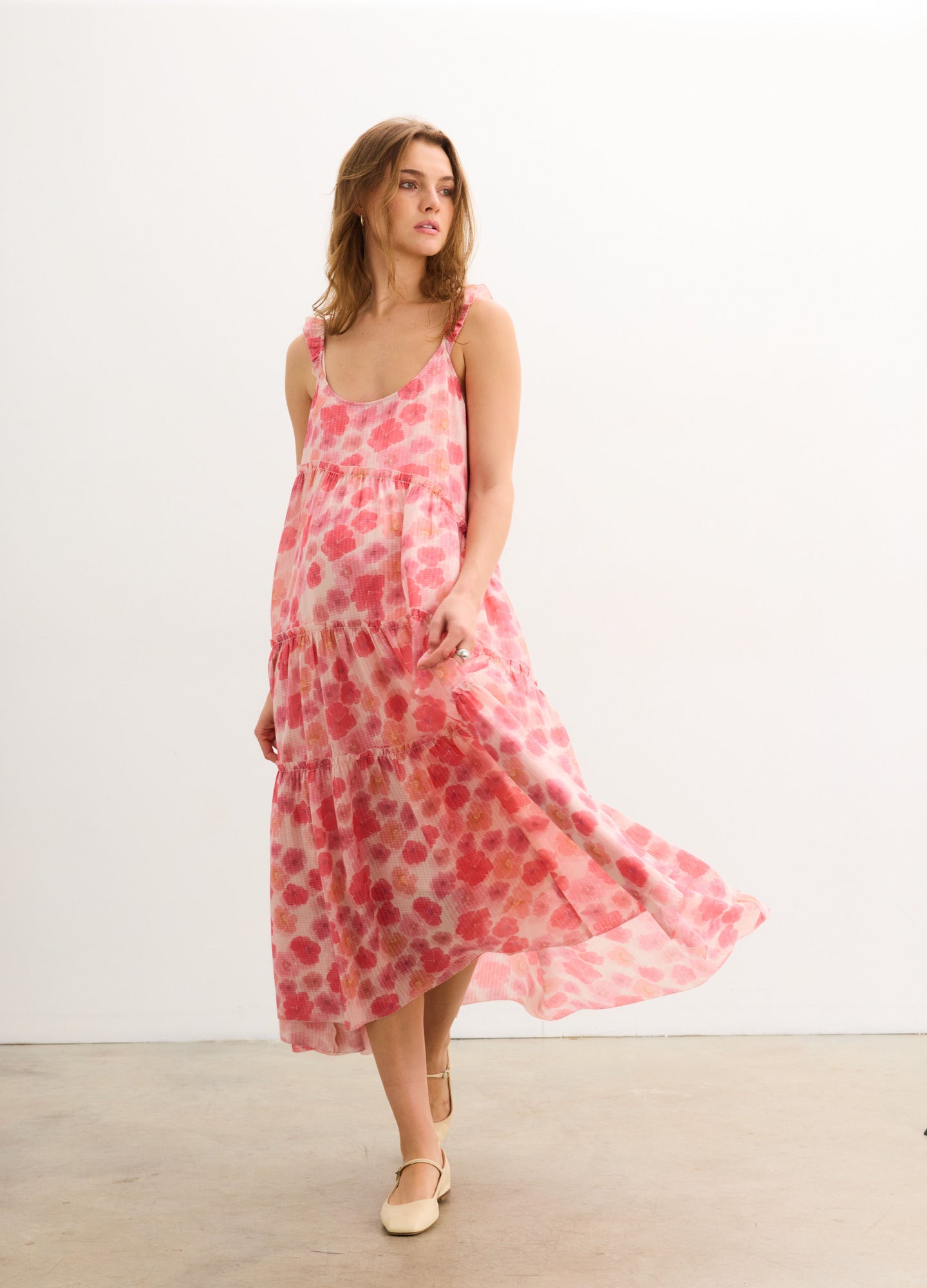 The Anaelle Dress - Flowy pink floral maternity dress with adjustable straps, designed for pregnancy, nursing, and postpartum comfort.