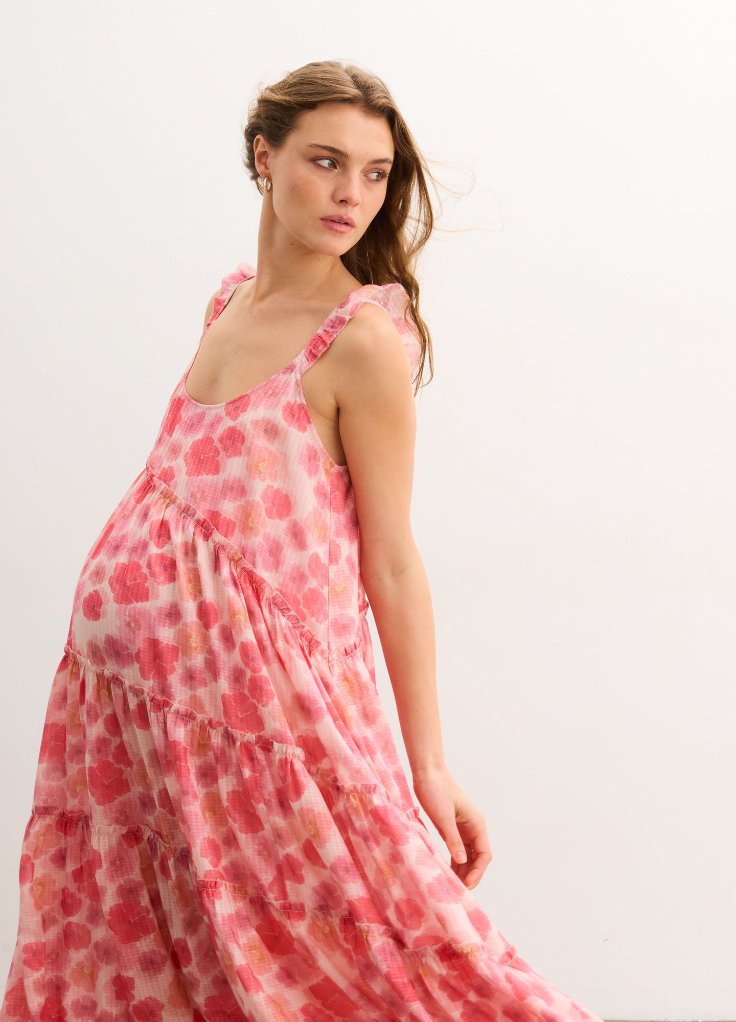 The Anaelle Dress - Flowy pink floral maternity dress with adjustable straps, designed for pregnancy, nursing, and postpartum comfort.