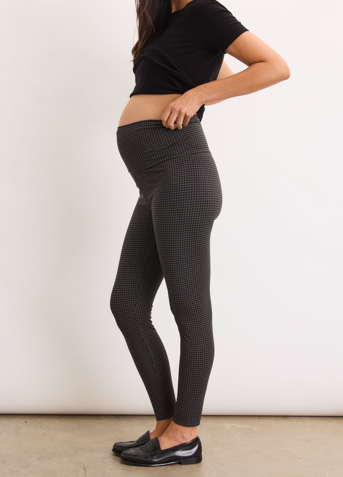 Black maternity leggings with high, stretchy waistband designed for pregnancy comfort.