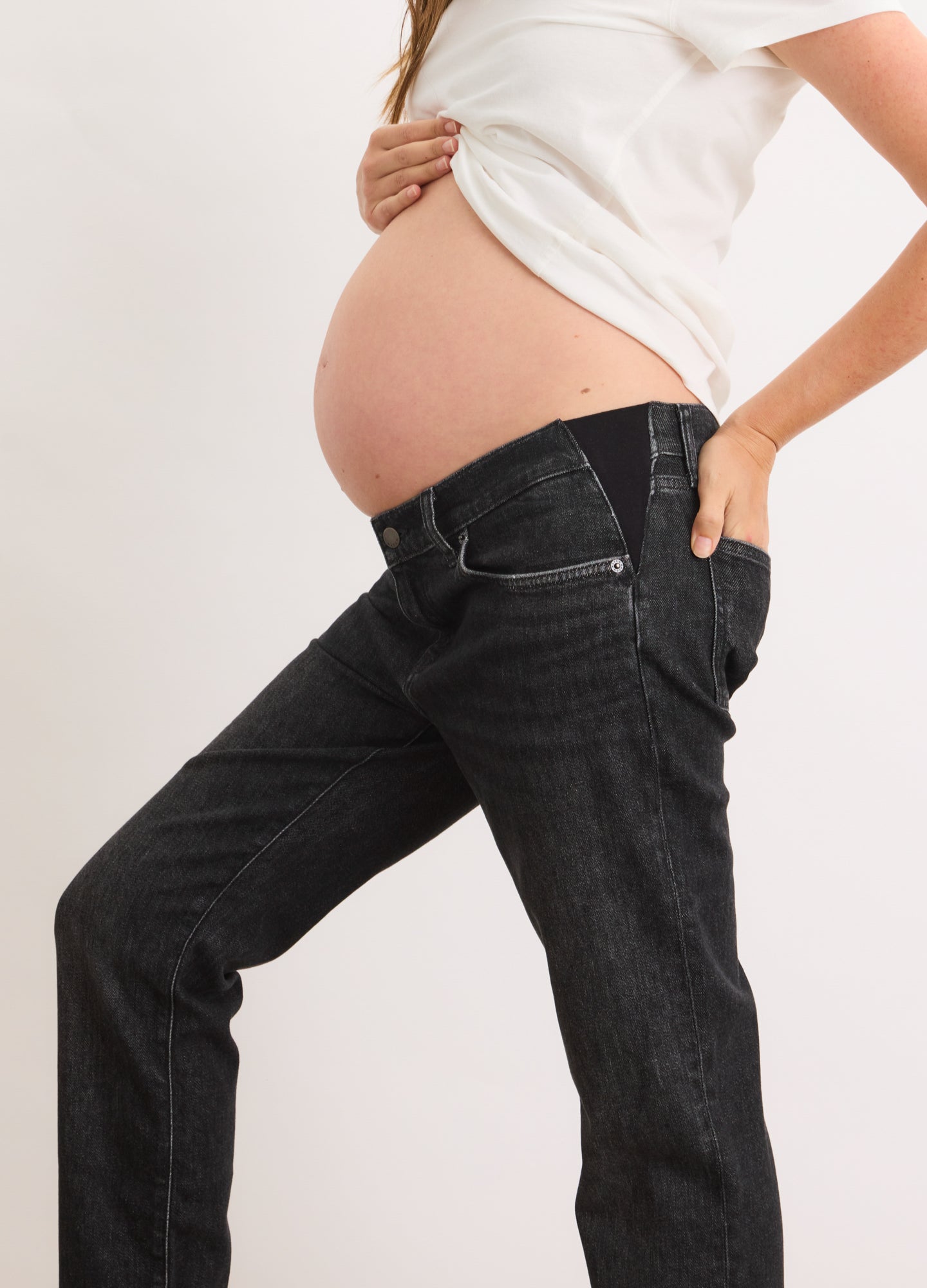 Black maternity boyfriend jeans with relaxed fit and stretchy waistband designed for pregnancy comfort.