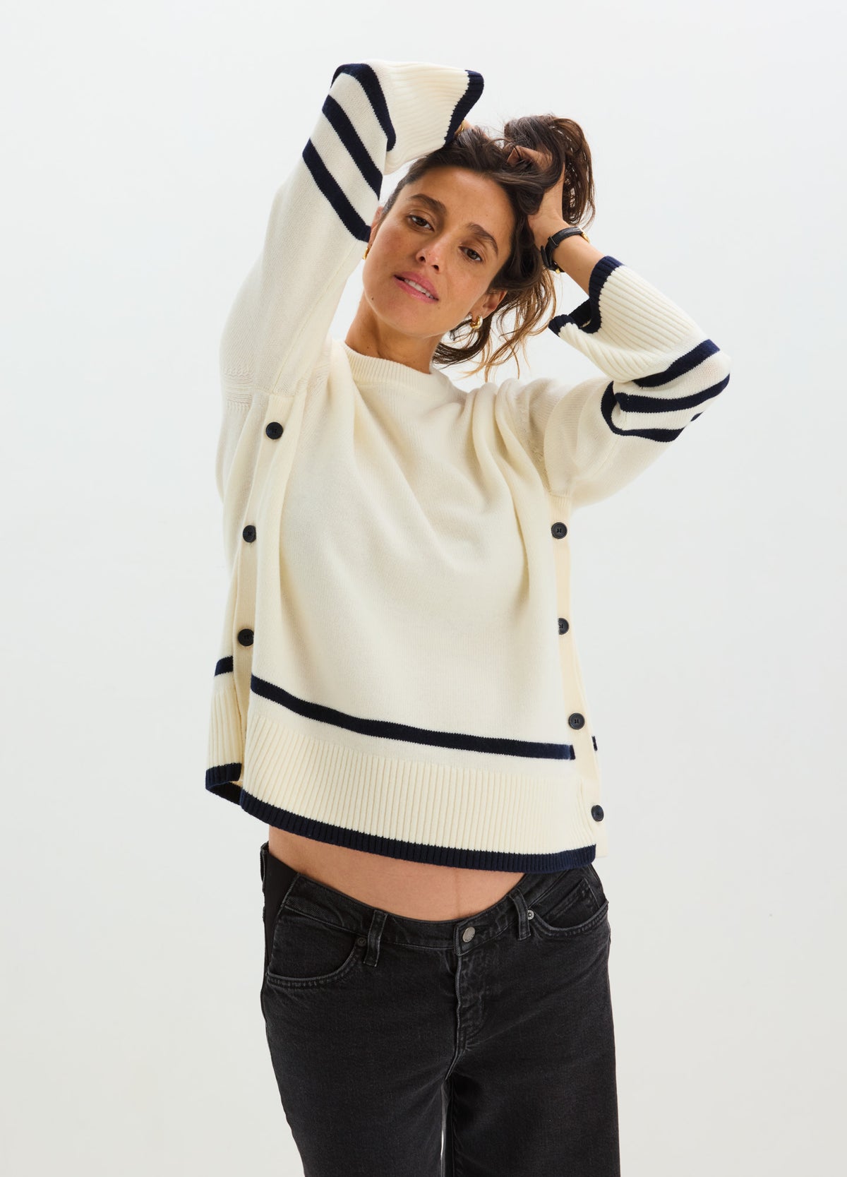 Cream maternity nursing sweater with navy stripes on sleeves and hem, button details on sides.