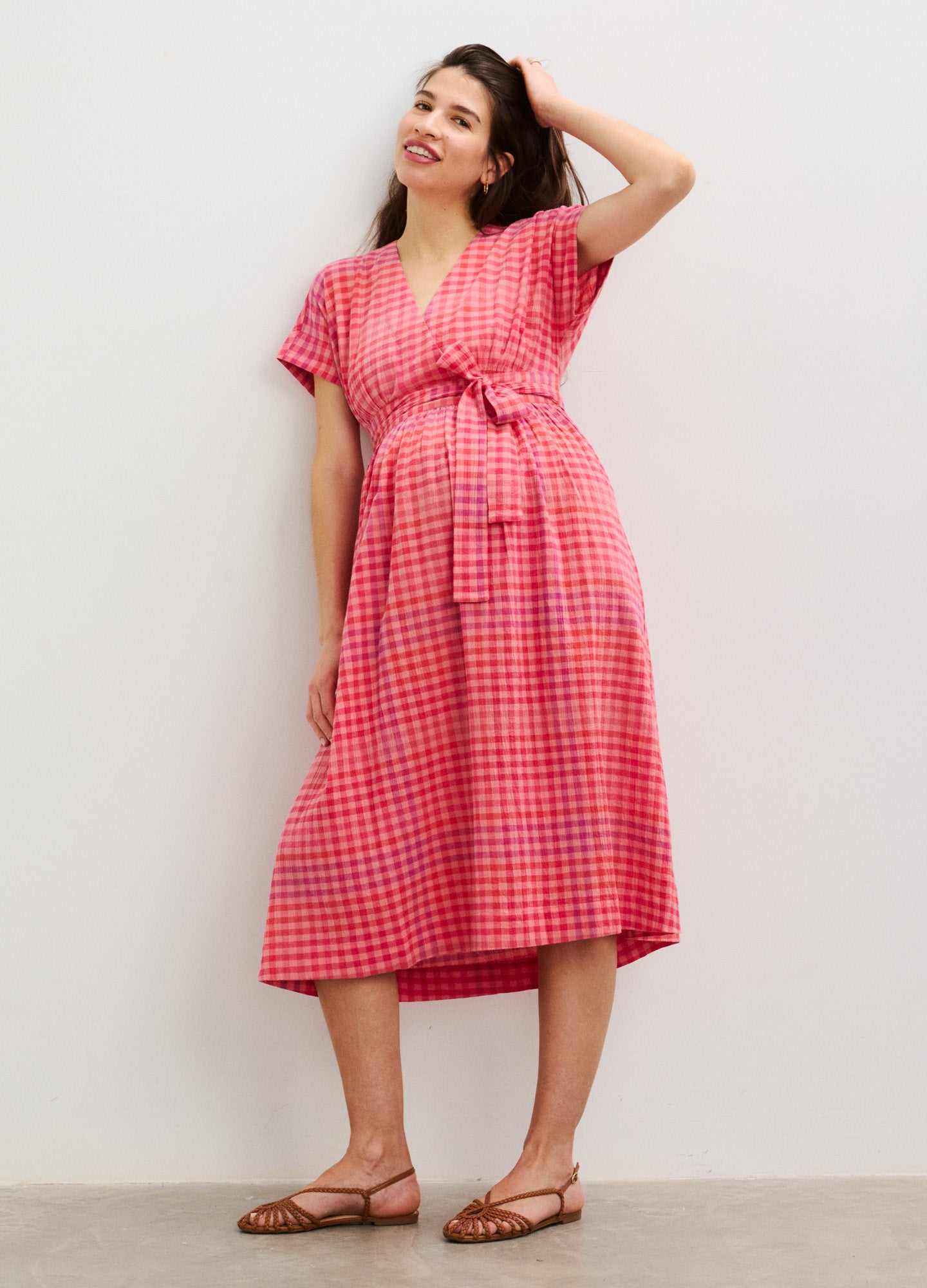 Red and white plaid maternity dress with short sleeves and a waist tie, midi length.