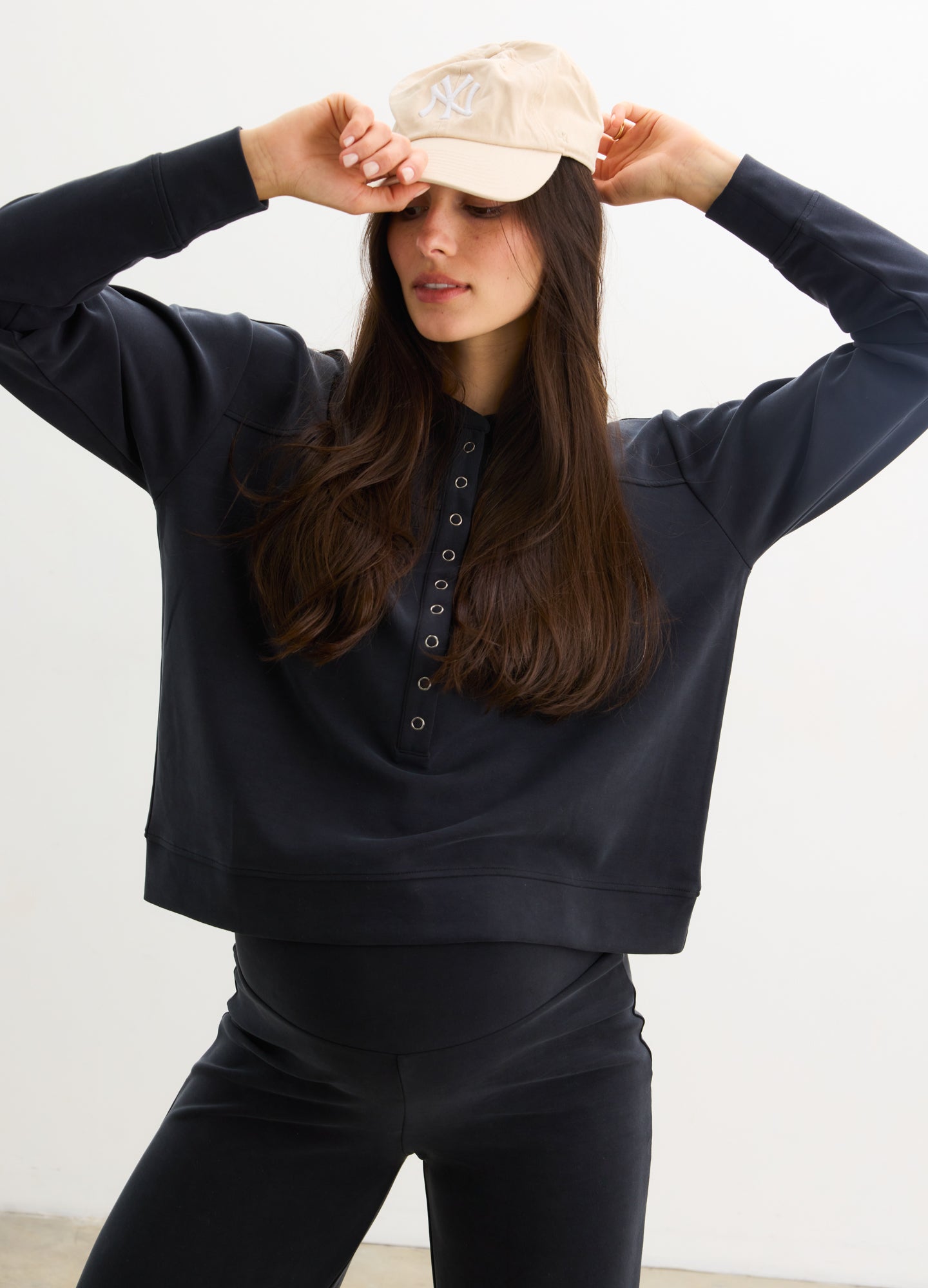 The Cloudease Travel Nursing Pullover - Women's washed black maternity pullover with relaxed fit, side nursing access, and matching wide-leg pants.
