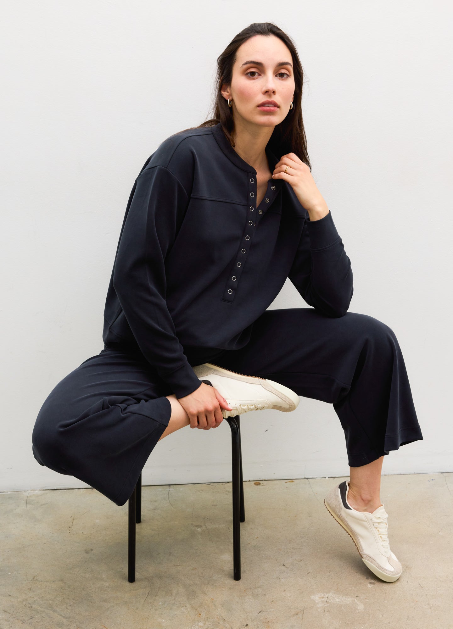 The Cloudease Travel Nursing Pullover - Women's washed black maternity pullover with relaxed fit, side nursing access, and matching wide-leg pants.