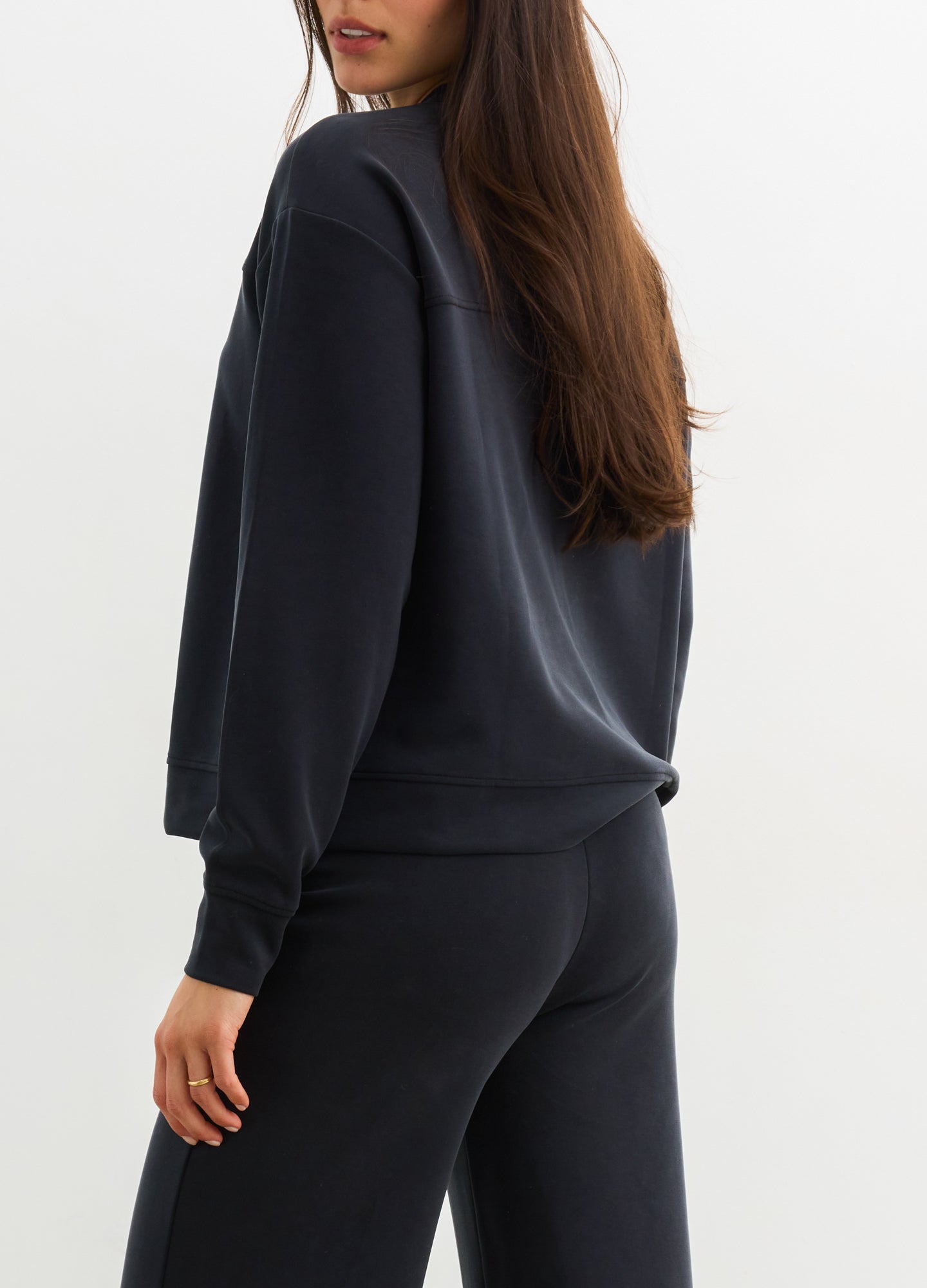 The Cloudease Travel Nursing Pullover - Women's washed black maternity pullover with relaxed fit, side nursing access, and matching wide-leg pants.