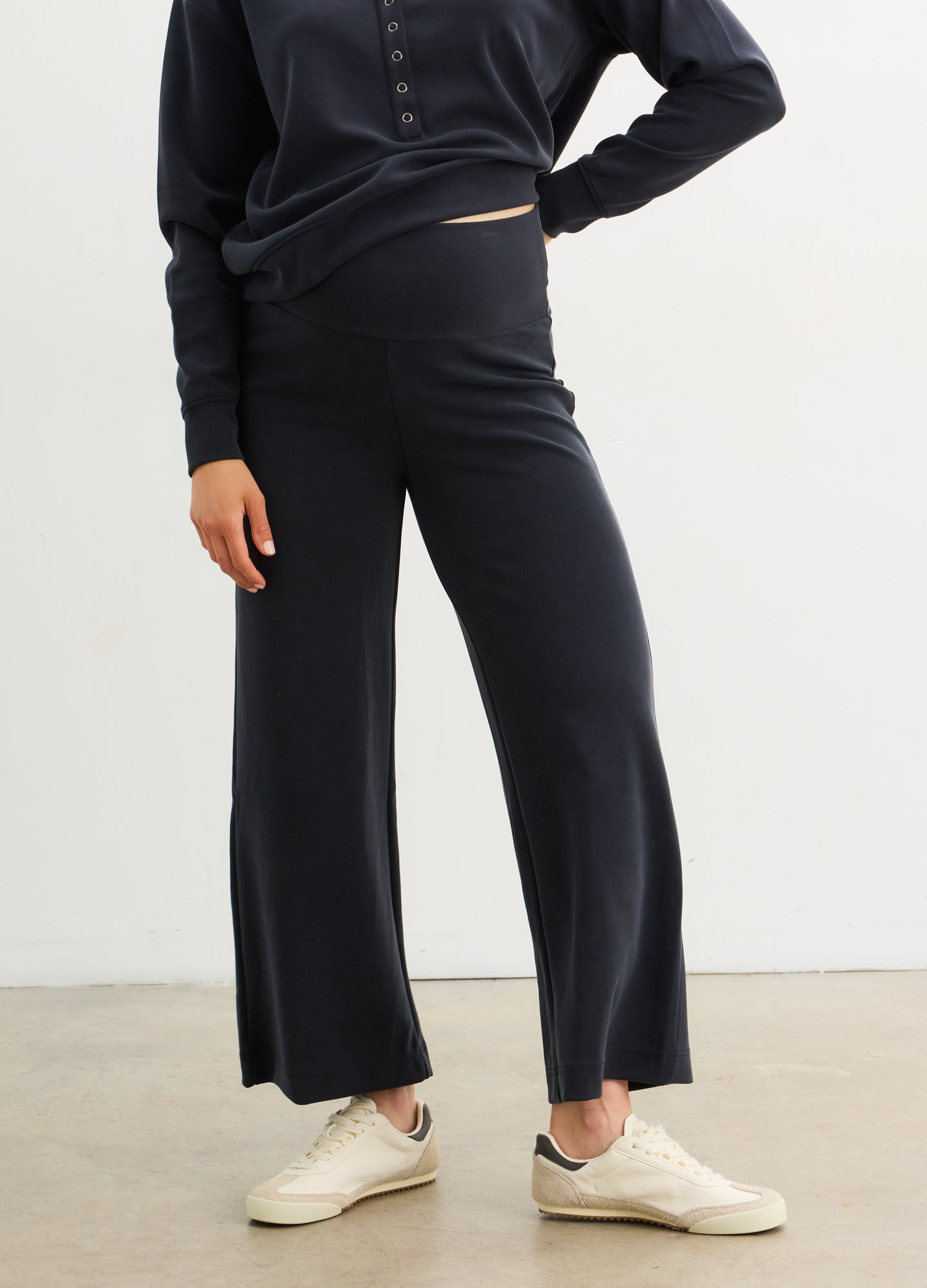 The Cloudease Travel Over Under Pant - Black maternity travel pants with relaxed fit and soft fabric, styled for pregnancy, nursing, and postpartum comfort.
