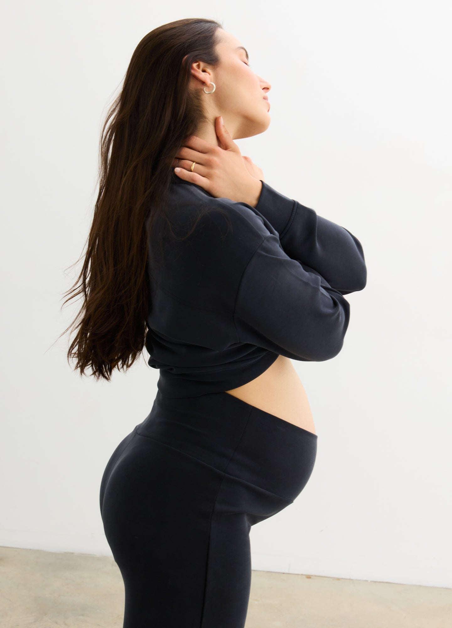 The Cloudease Travel Over Under Pant - Black maternity travel pants with relaxed fit and soft fabric, styled for pregnancy, nursing, and postpartum comfort.