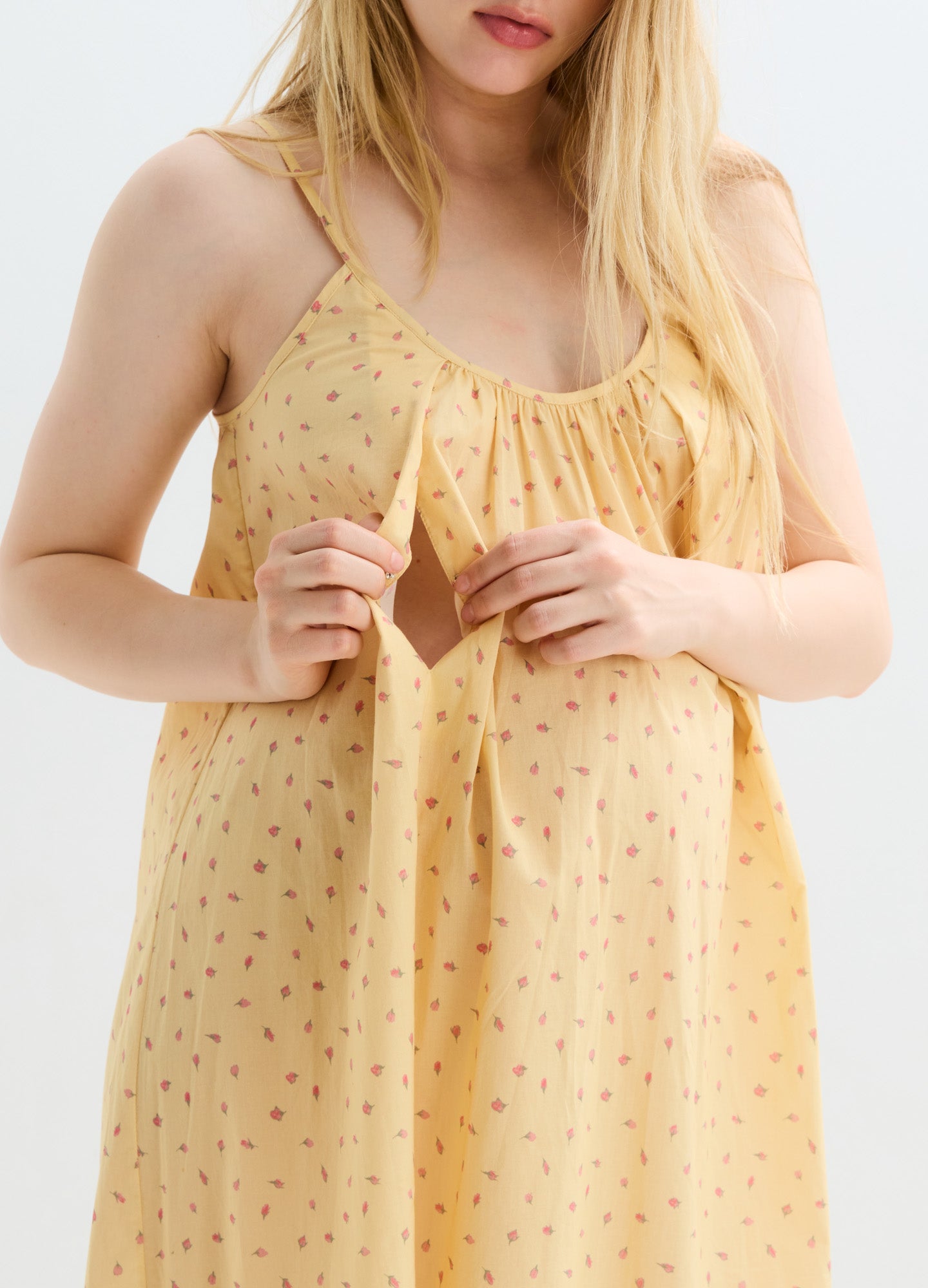 Yellow maternity nursing nightgown with small red floral print, sleeveless with adjustable straps.