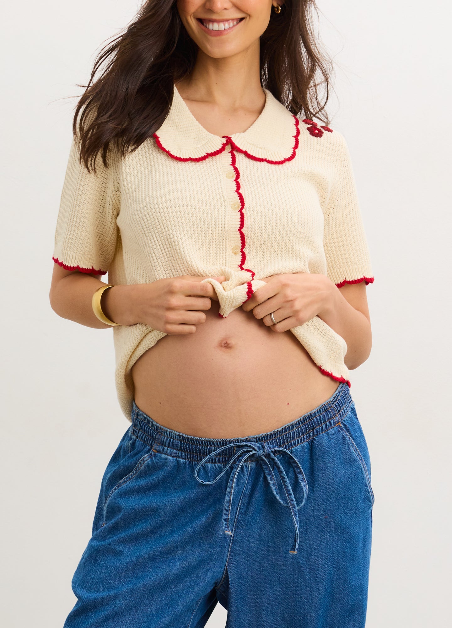 The Crochet Scallop Cardigan - Cream crochet scallop cardigan with red trim, short sleeves, and nursing-friendly front buttons for maternity and postpartum .