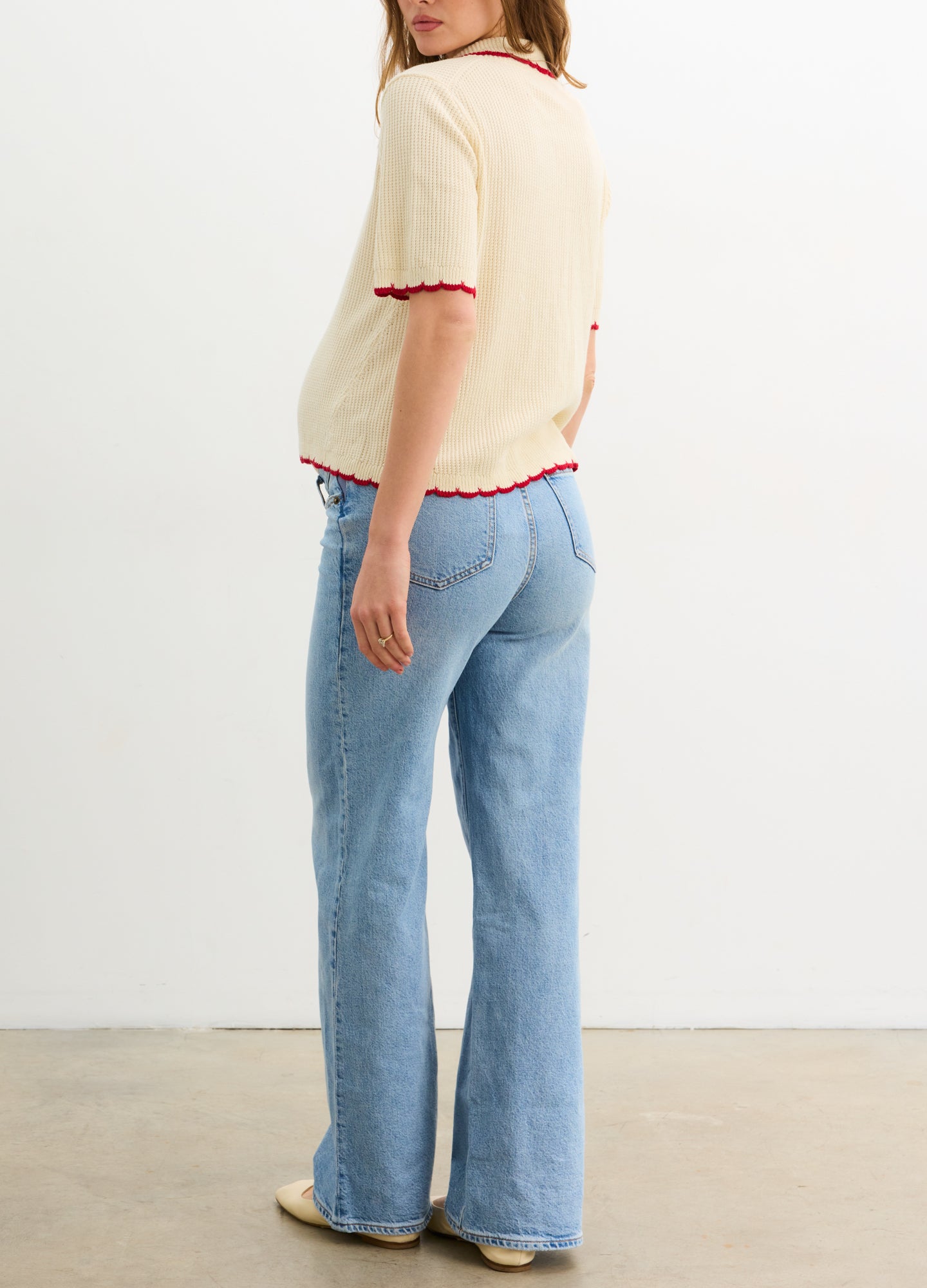 The Crochet Scallop Cardigan - Cream crochet scallop cardigan with red trim, short sleeves, and nursing-friendly front buttons for maternity and postpartum .