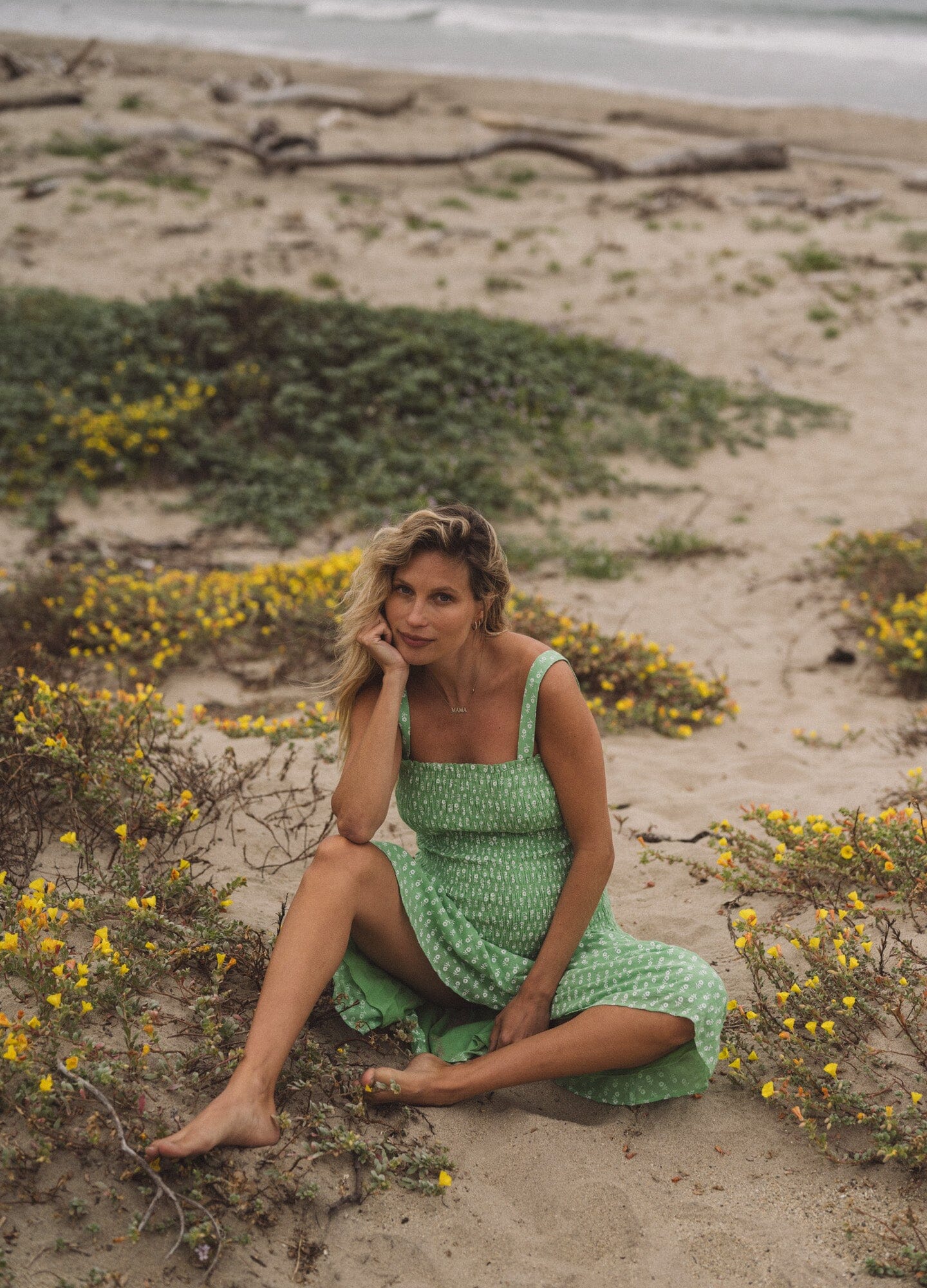 The Evie Dress - Green ditsy batik maternity dress with adjustable straps and smocked bust for pregnancy, nursing, and postpartum comfort.