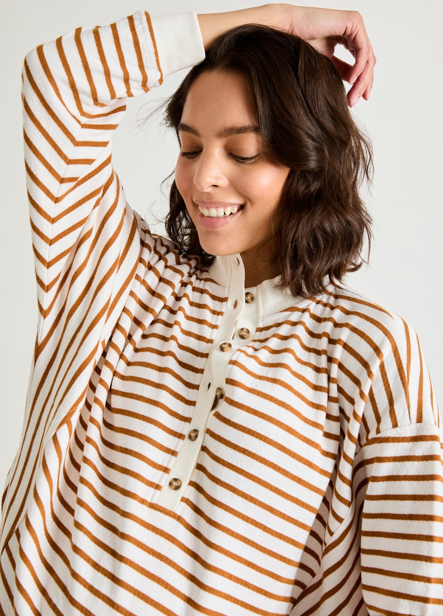 The Dakota Striped Nursing Sweatshirt - Camel striped maternity nursing sweatshirt with front button placket and relaxed fit for pregnancy and postpartum comfort.