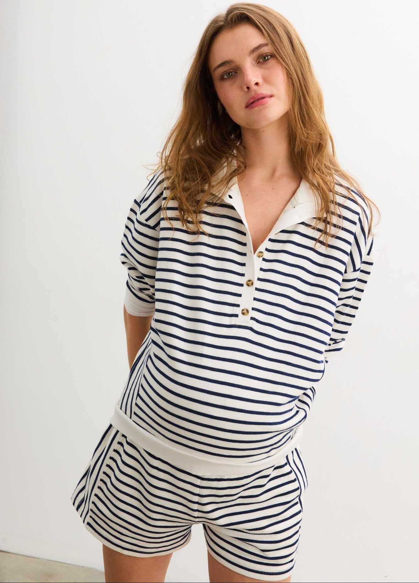 The Dakota Striped Nursing Sweatshirt - Navy and white striped maternity nursing sweatshirt with long sleeves and relaxed fit, styled for pregnancy and postpartum.