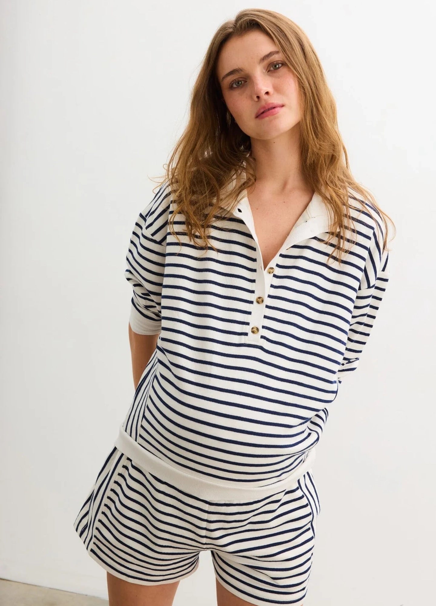 The Dakota Striped Short - Navy and white striped maternity shorts with elastic waist, styled for pregnancy, nursing, and postpartum comfort.