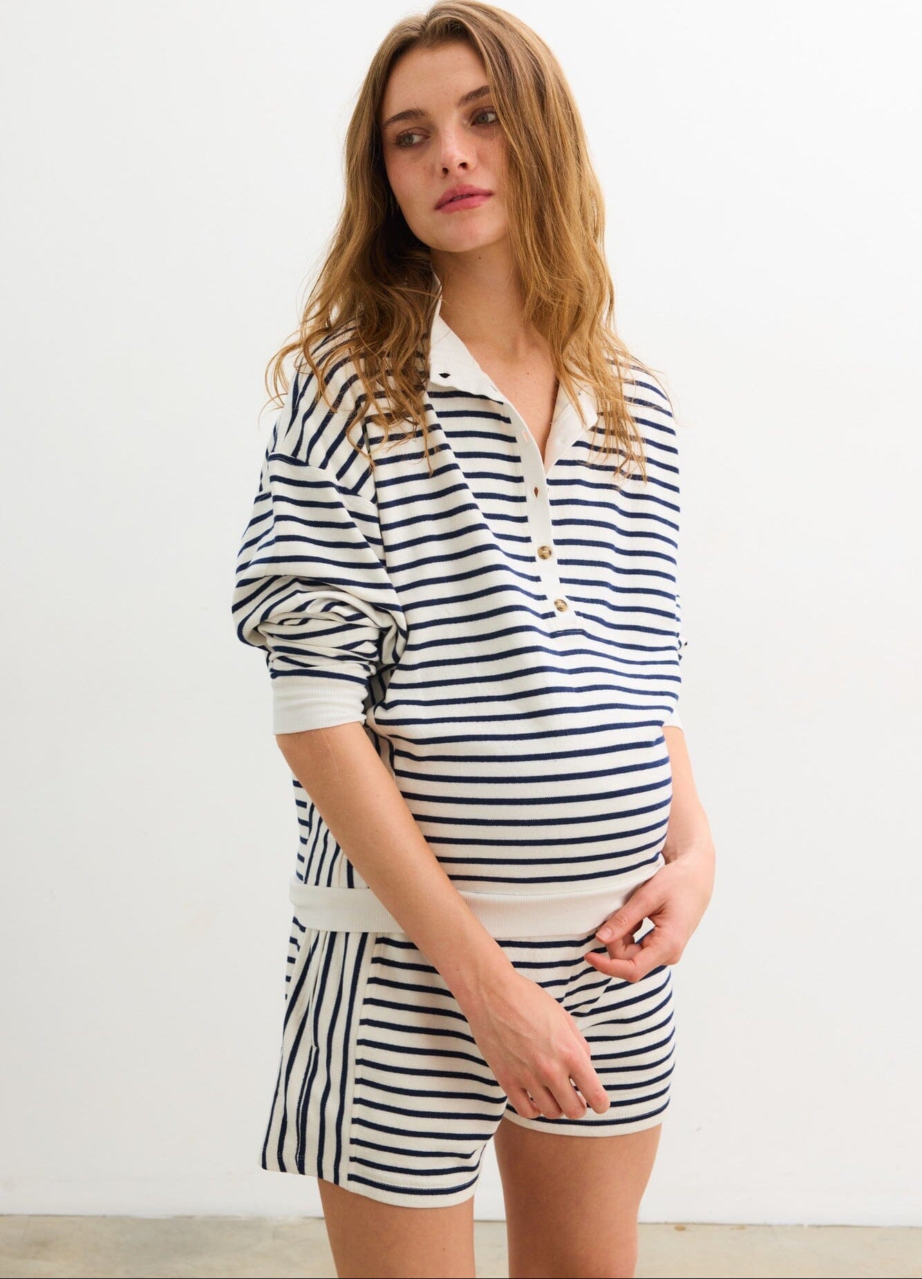 The Dakota Striped Nursing Sweatshirt - Navy and white striped maternity nursing sweatshirt with long sleeves and relaxed fit, styled for pregnancy and postpartum.