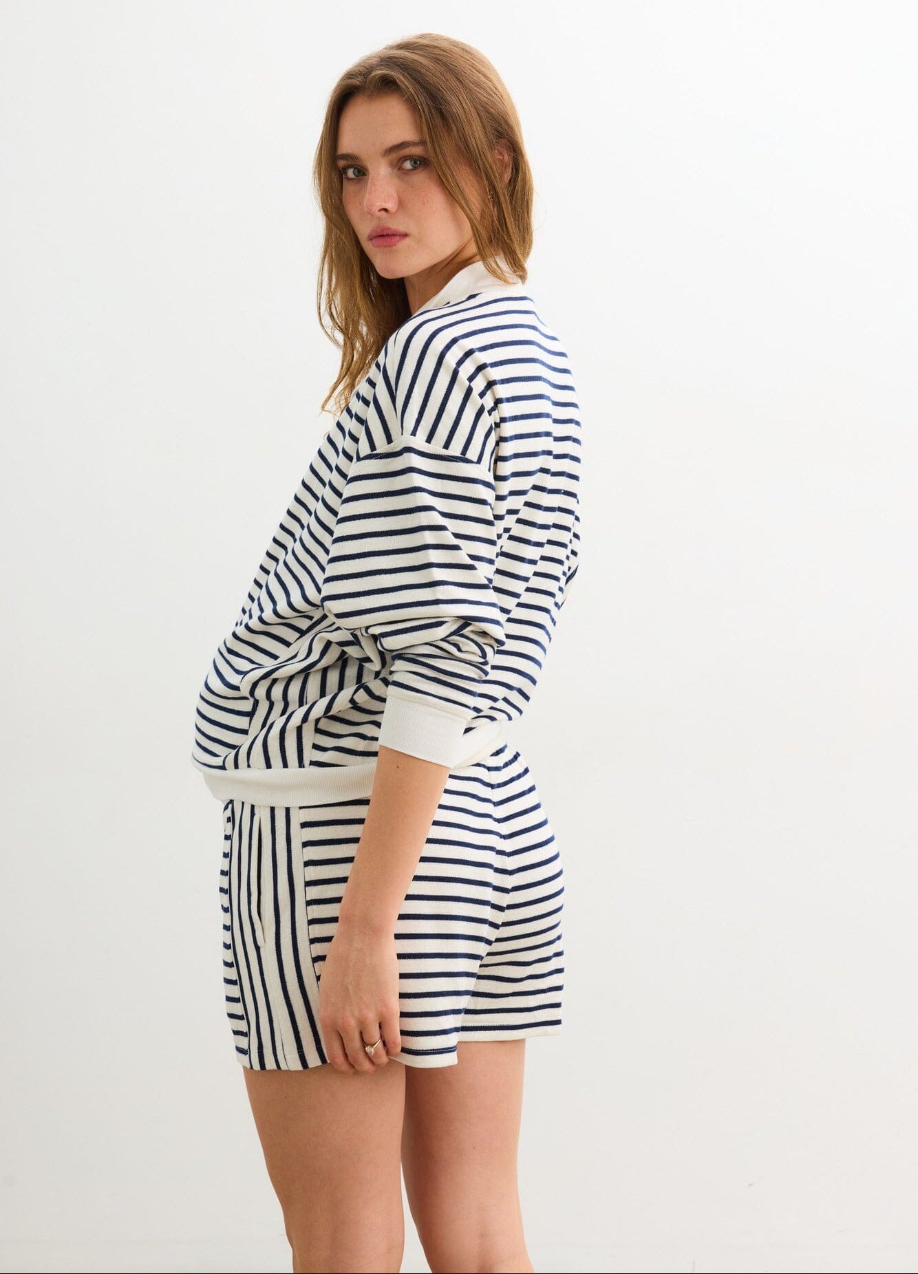 The Dakota Striped Short - Navy and white striped maternity shorts with elastic waist, styled for pregnancy, nursing, and postpartum comfort.