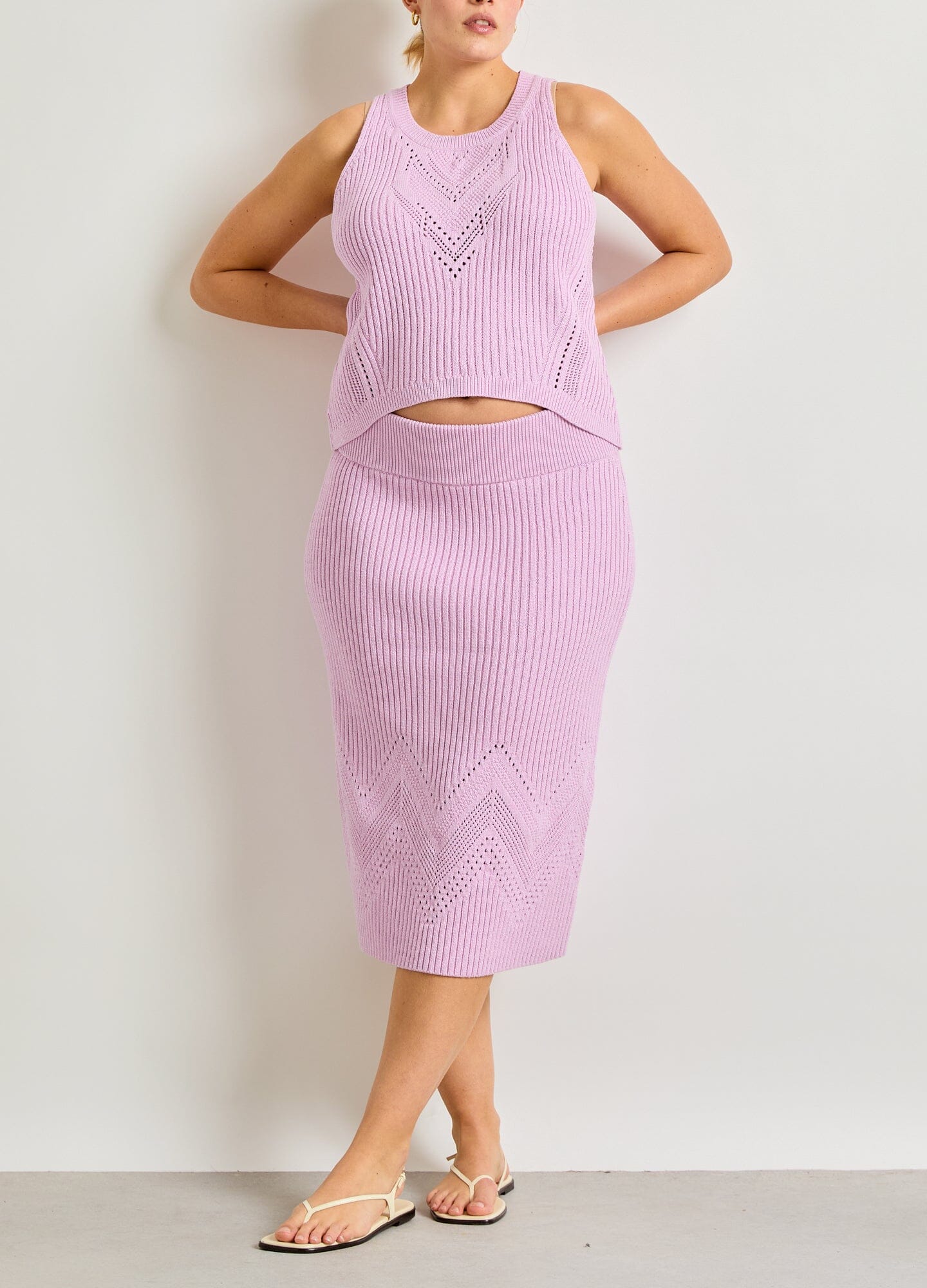 The Delphine Cotton Pointelle Skirt - Pink lilac cotton pointelle maternity skirt with a chevron pattern and soft stretch for pregnancy and postpartum wear.