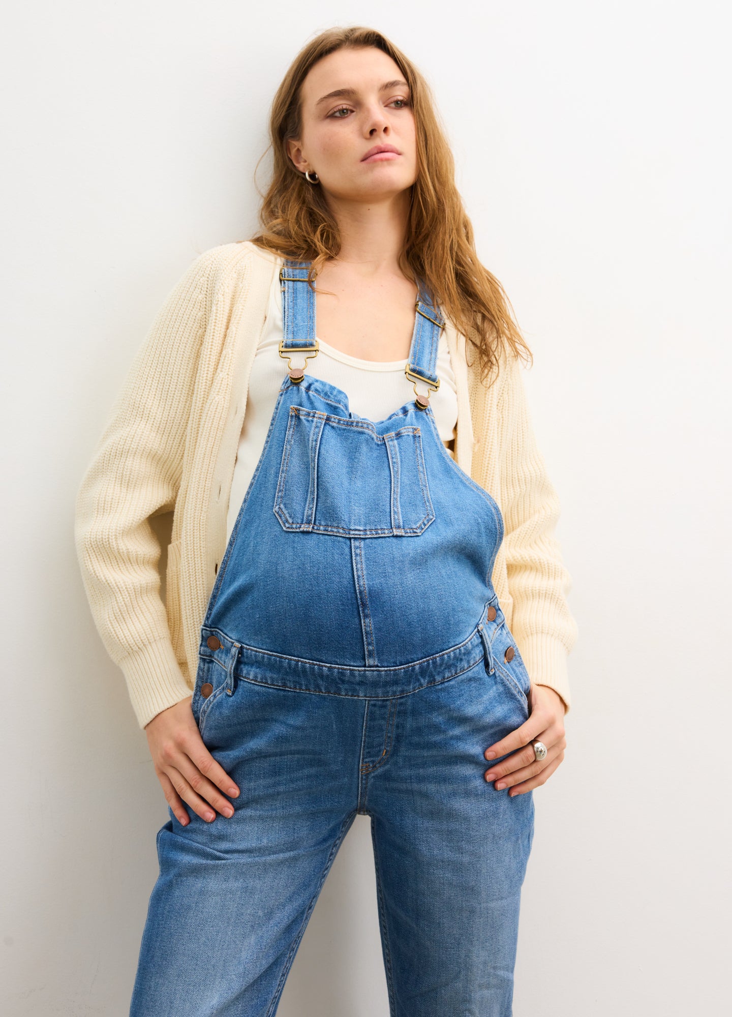 The Denim Maternity Overall - Indigo denim maternity overall with adjustable straps, side buttons, and roomy front panel for pregnancy, nursing, and.