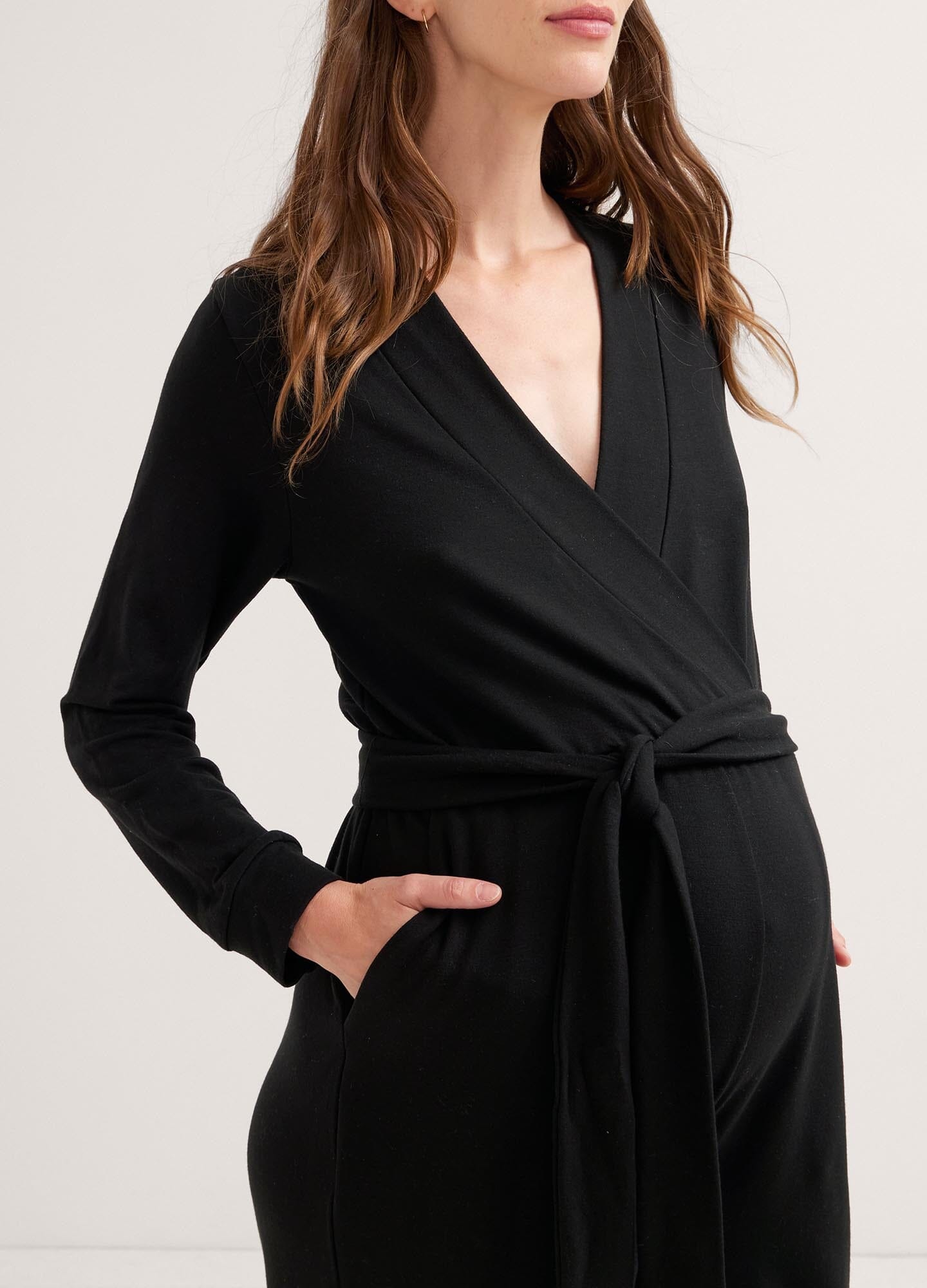 The Easy Nursing Jumpsuit - Black maternity jumpsuit with long sleeves, nursing-friendly front zipper, and relaxed wide-leg fit for postpartum comfort.