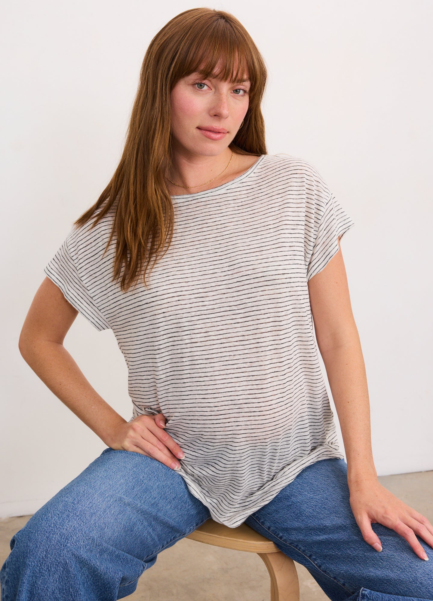 Light grey and white striped linen maternity tee with short sleeves and relaxed fit.