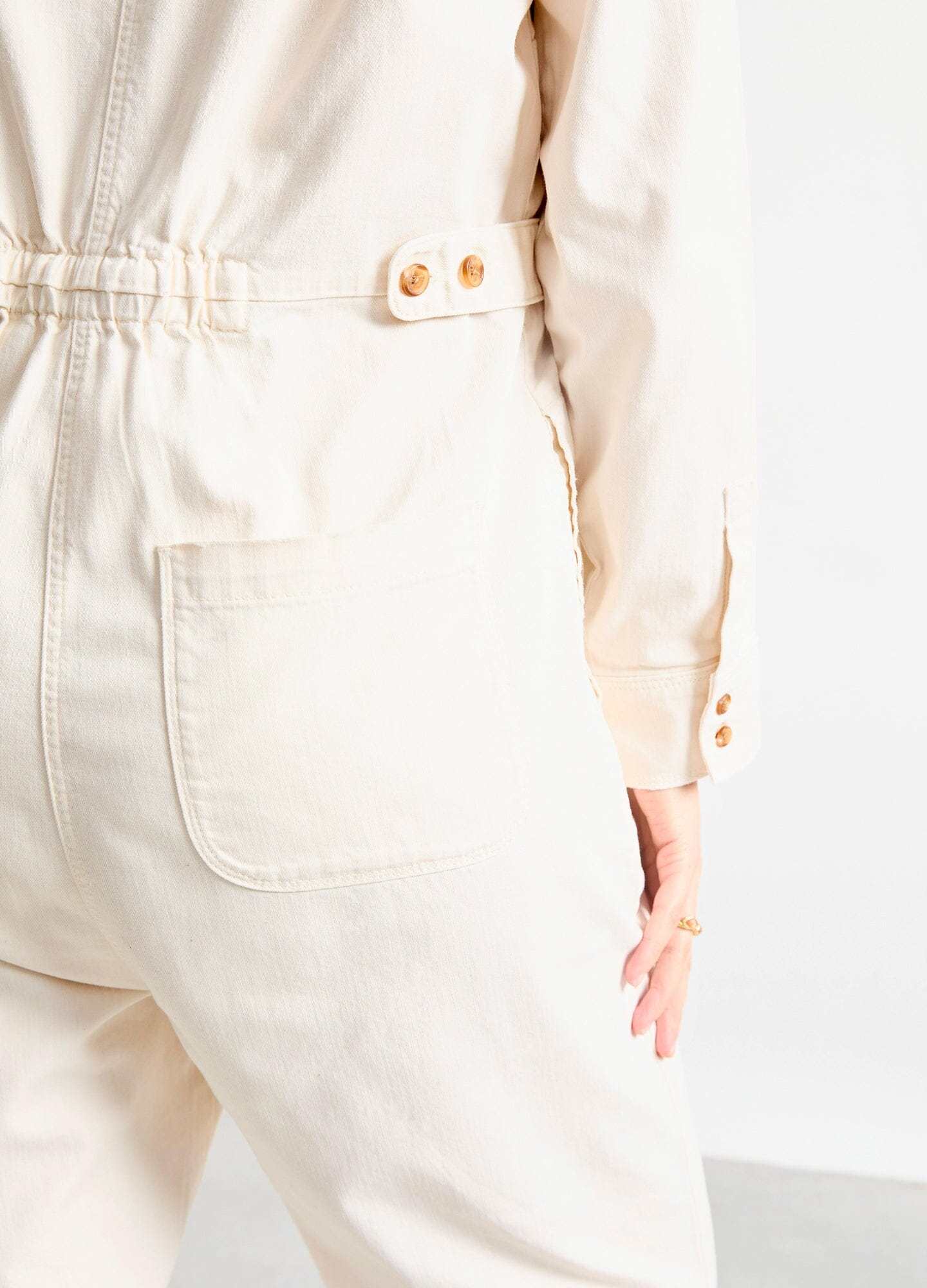 The Everyday Nursing Denim Jumpsuit - Vanilla maternity denim jumpsuit with button-front nursing access, relaxed fit for pregnancy and postpartum.