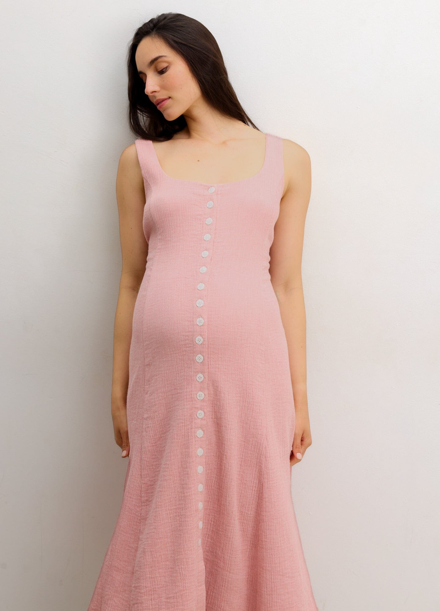 The Felicity Dress - Soft pink sleeveless maternity dress with front button closure, designed for nursing and postpartum comfort.