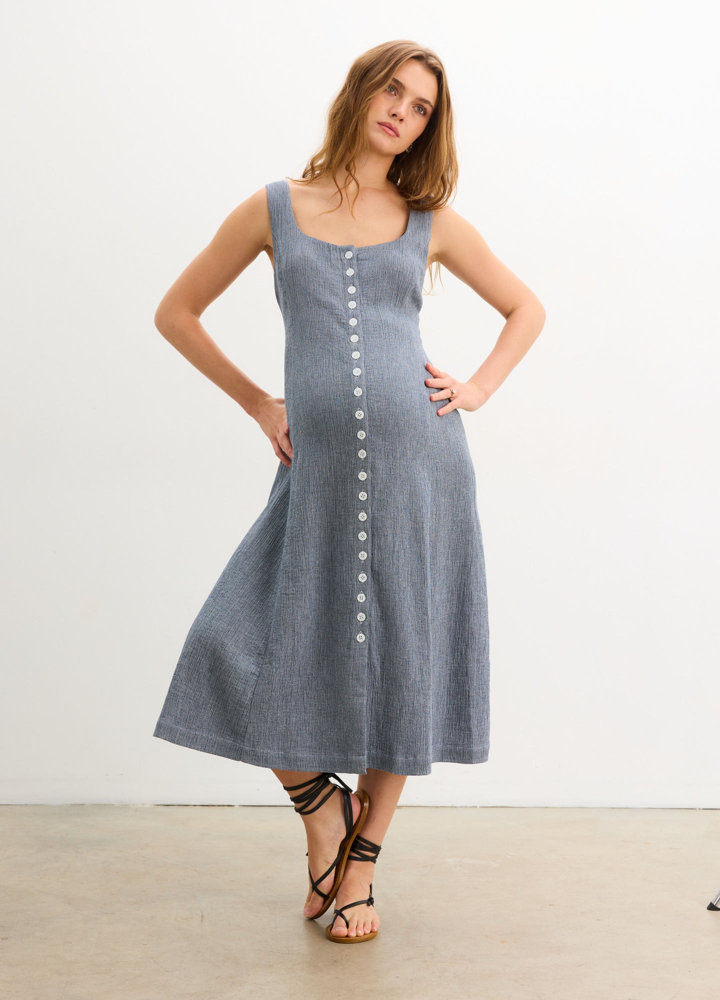 The Felicity Dress - Navy button-front maternity dress with sleeveless design for nursing and postpartum comfort.