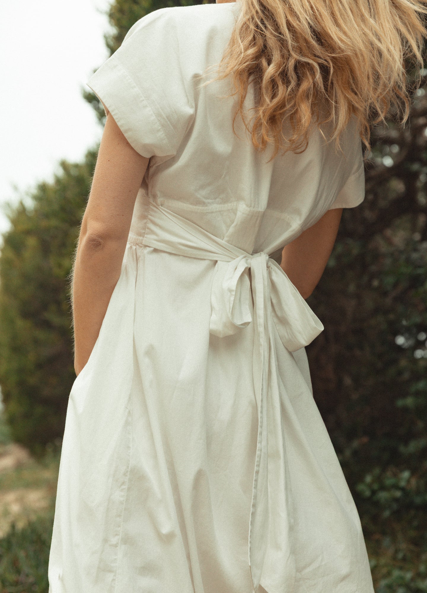 The Floral Embroidered Carolina Dress - White cotton poplin maternity dress with floral embroidery and scalloped hem, designed for pregnancy, nursing, and.