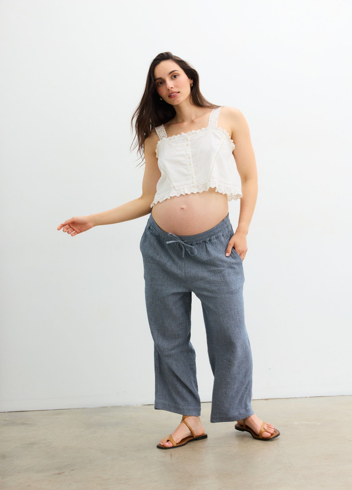 The Hayden Pant - Navy maternity pants with relaxed fit and elastic waistband, styled for pregnancy and postpartum comfort.