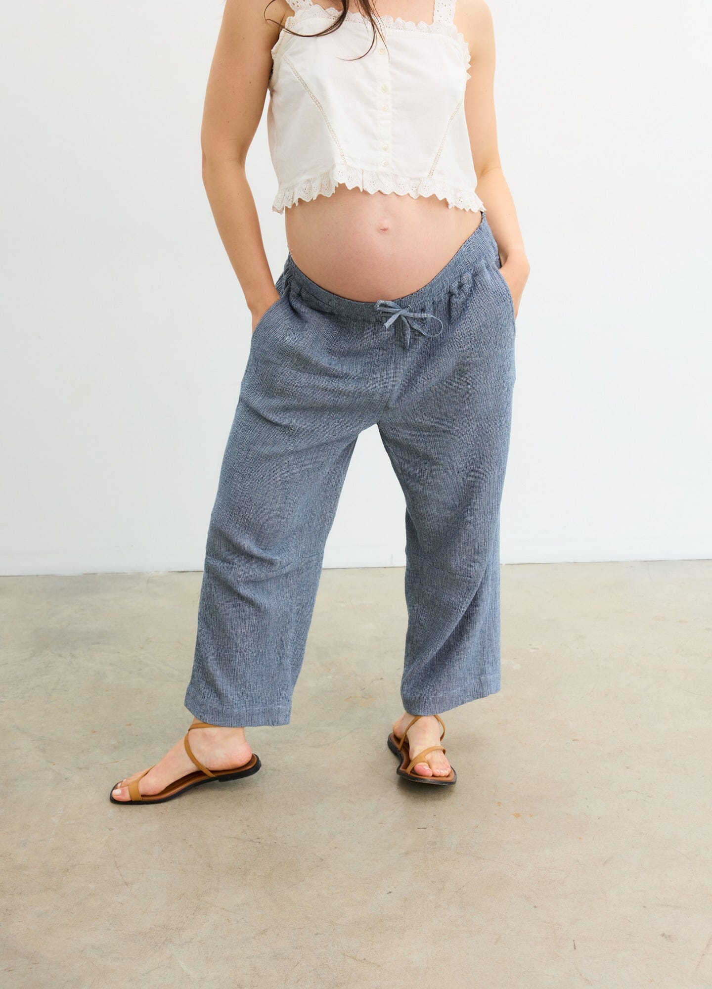 The Hayden Pant - Navy maternity pants with relaxed fit and elastic waistband, styled for pregnancy and postpartum comfort.