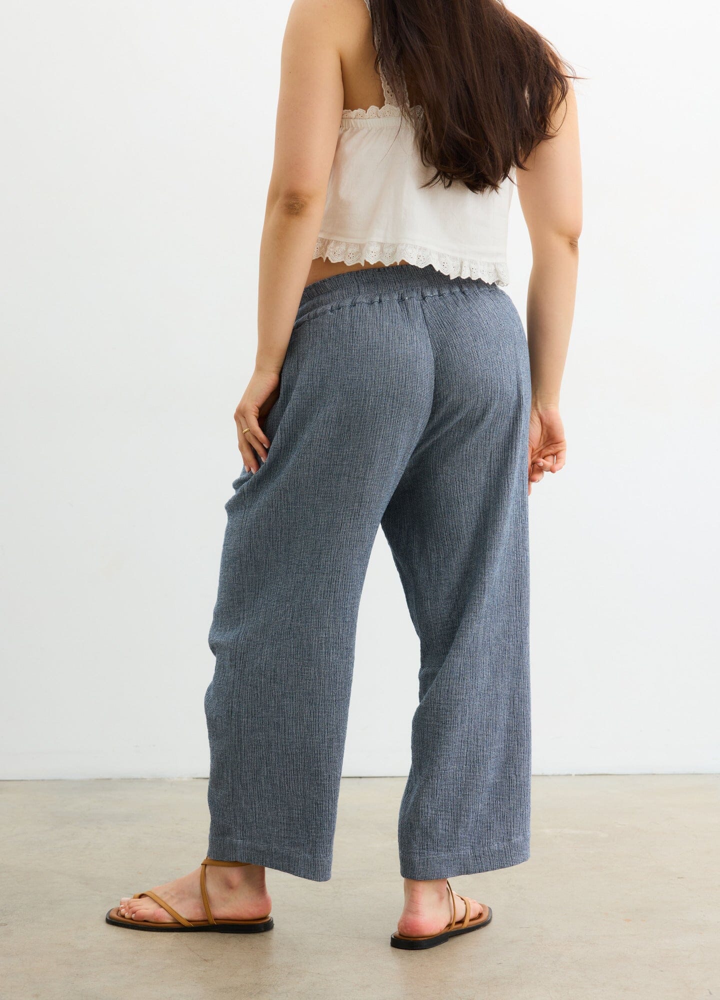 The Hayden Pant - Navy maternity pants with relaxed fit and elastic waistband, styled for pregnancy and postpartum comfort.