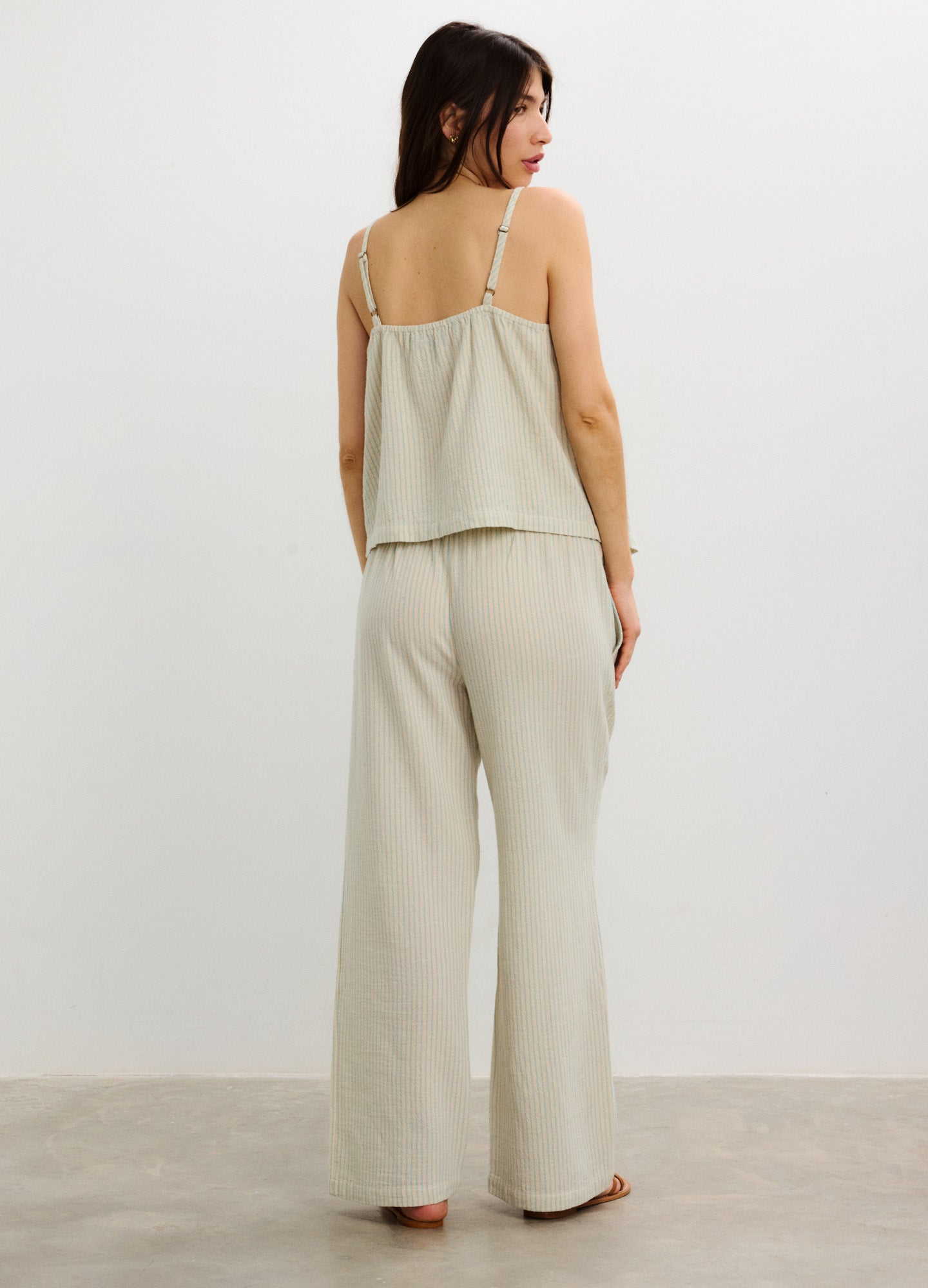 Light beige wide-leg maternity pants with a soft, stretchy waistband designed for pregnant women.