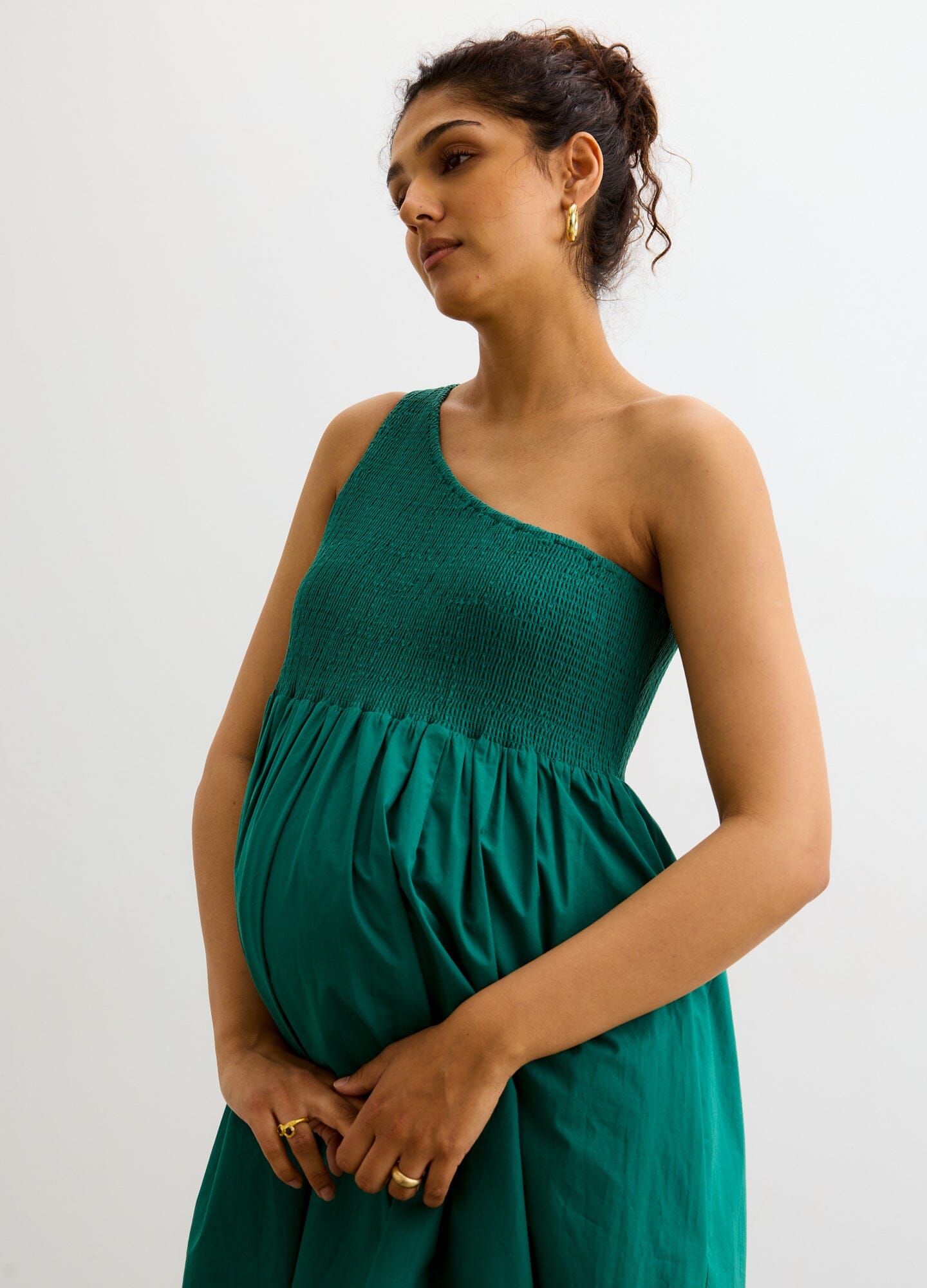 The Kendra Dress - Antique green one-shoulder maternity dress with smocked bodice and flowing skirt, ideal for pregnancy and nursing.