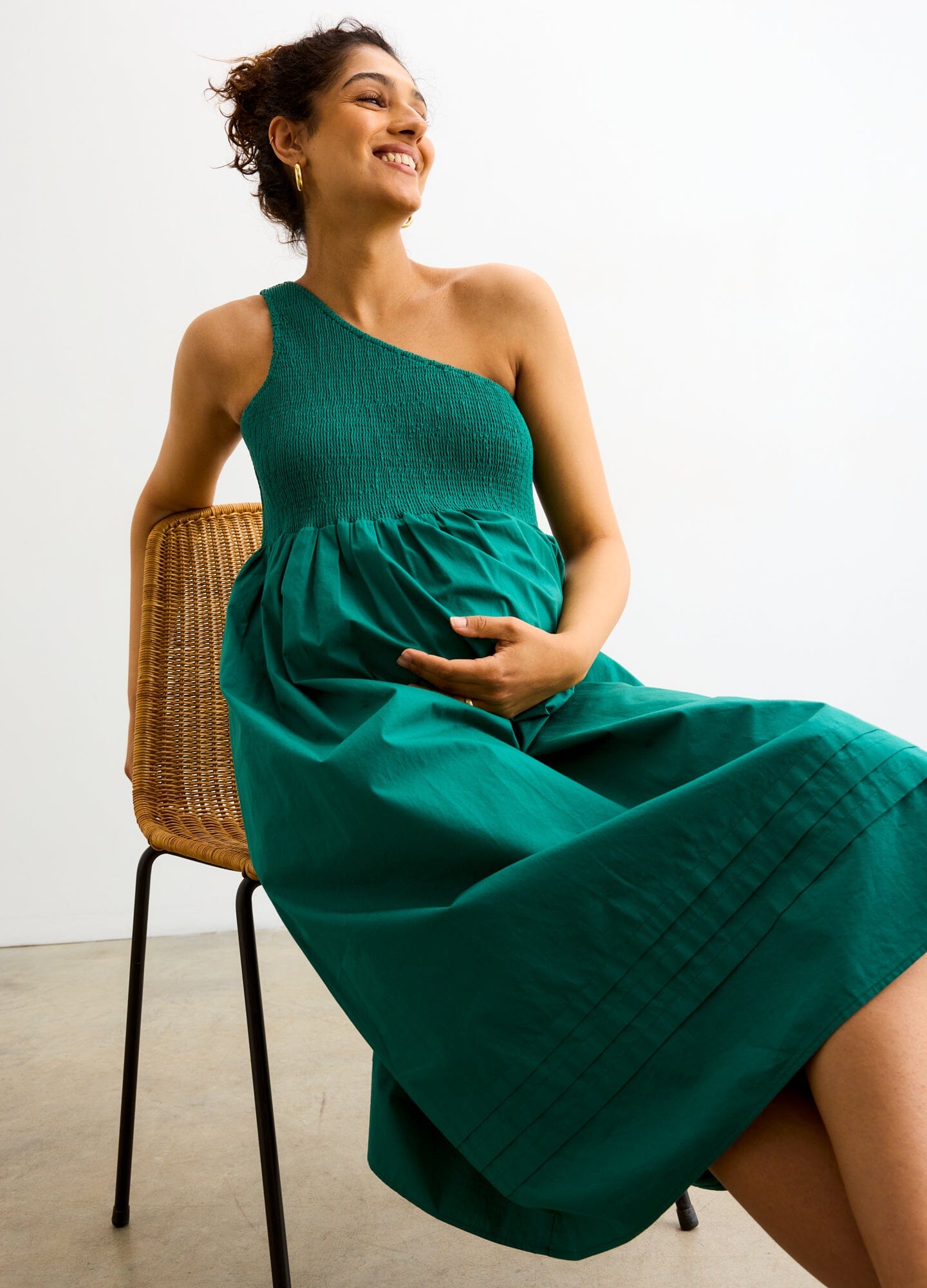 The Kendra Dress - Antique green one-shoulder maternity dress with smocked bodice and flowing skirt, ideal for pregnancy and nursing.