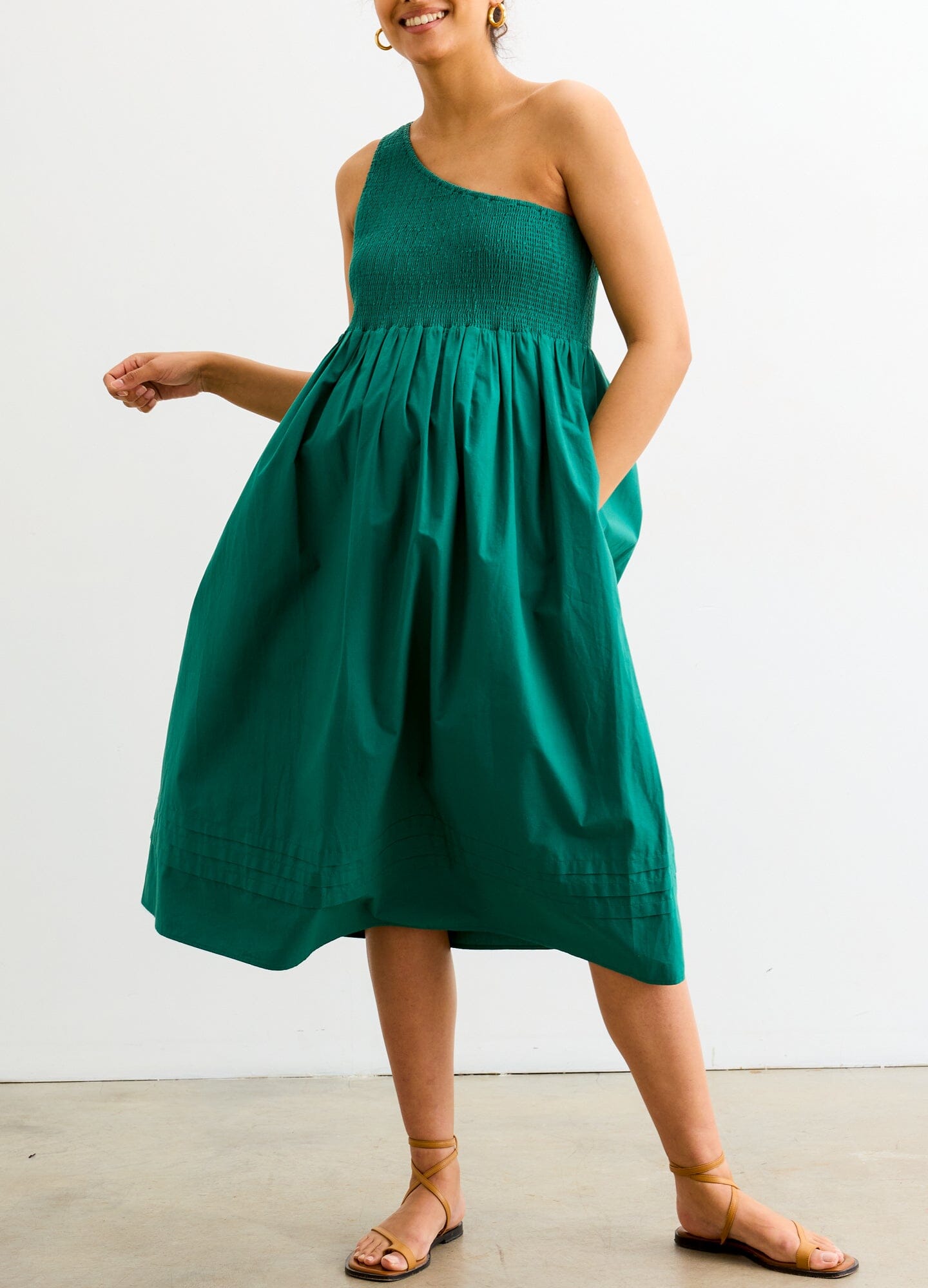 The Kendra Dress - Antique green one-shoulder maternity dress with smocked bodice and flowing skirt, ideal for pregnancy and nursing.
