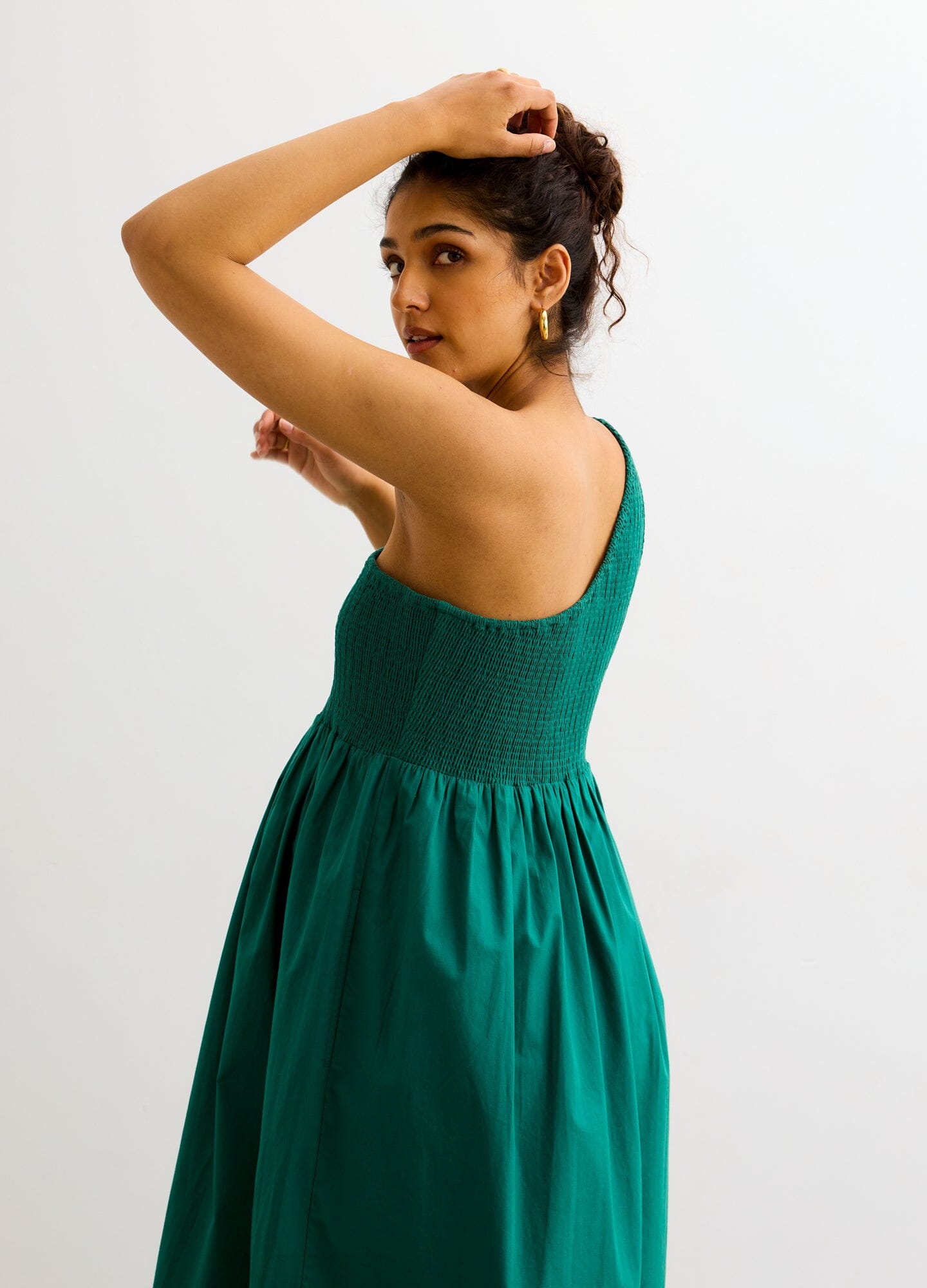 The Kendra Dress - Antique green one-shoulder maternity dress with smocked bodice and flowing skirt, ideal for pregnancy and nursing.