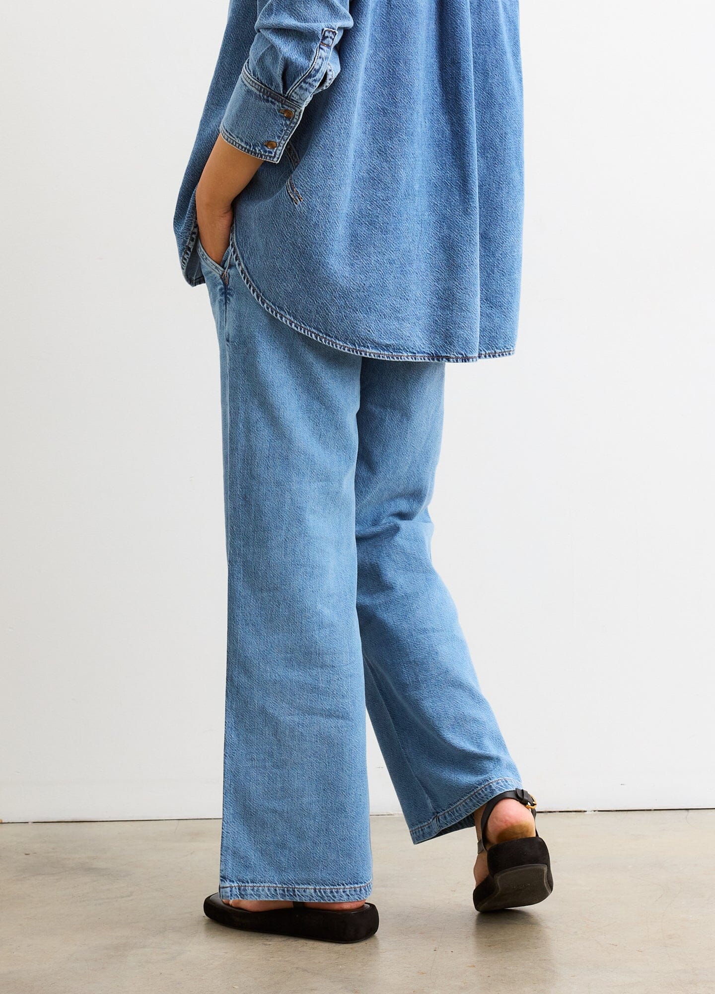 The Ellie Denim Pant - Light blue maternity denim pant with a stretchy waistband, relaxed wide-leg fit for pregnancy and postpartum comfort.