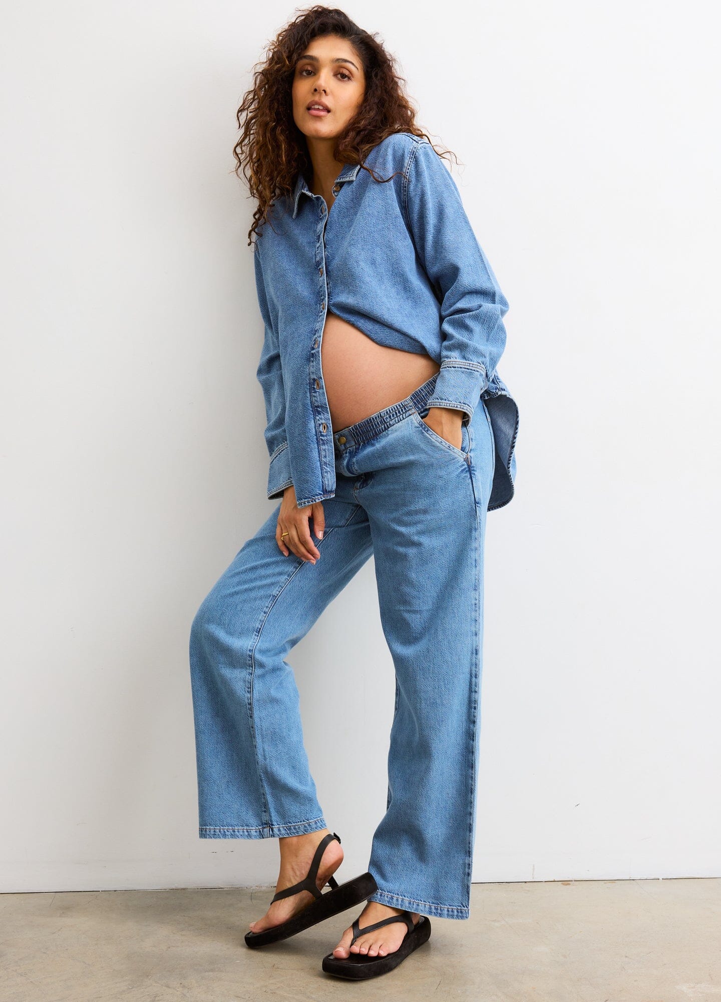 The Ellie Denim Pant - Light blue maternity denim pant with a stretchy waistband, relaxed wide-leg fit for pregnancy and postpartum comfort.