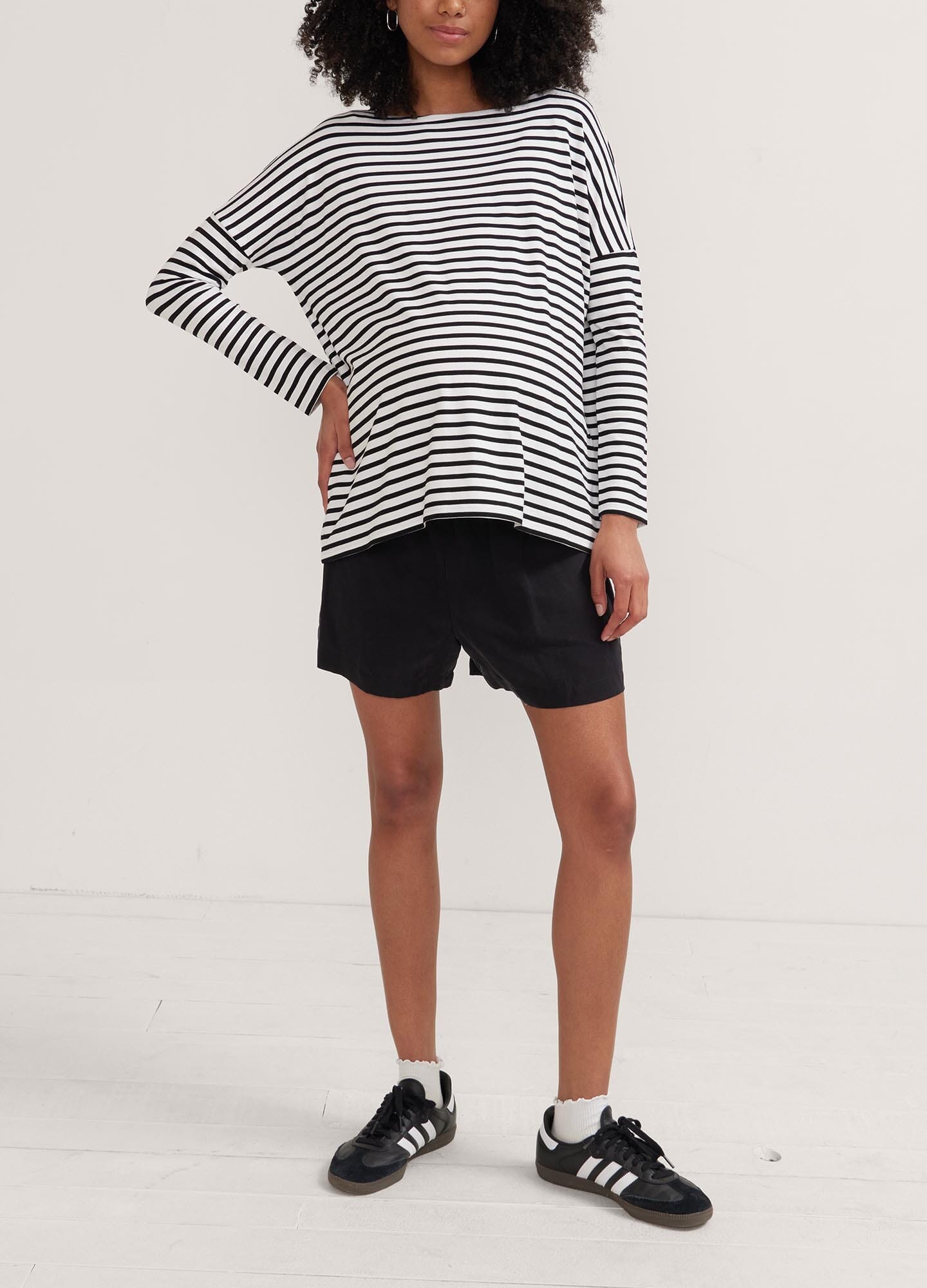 The Perfect Longsleeve Tee - Black and white striped maternity long sleeve tee with relaxed fit and round neckline, designed for pregnancy, nursing, and.
