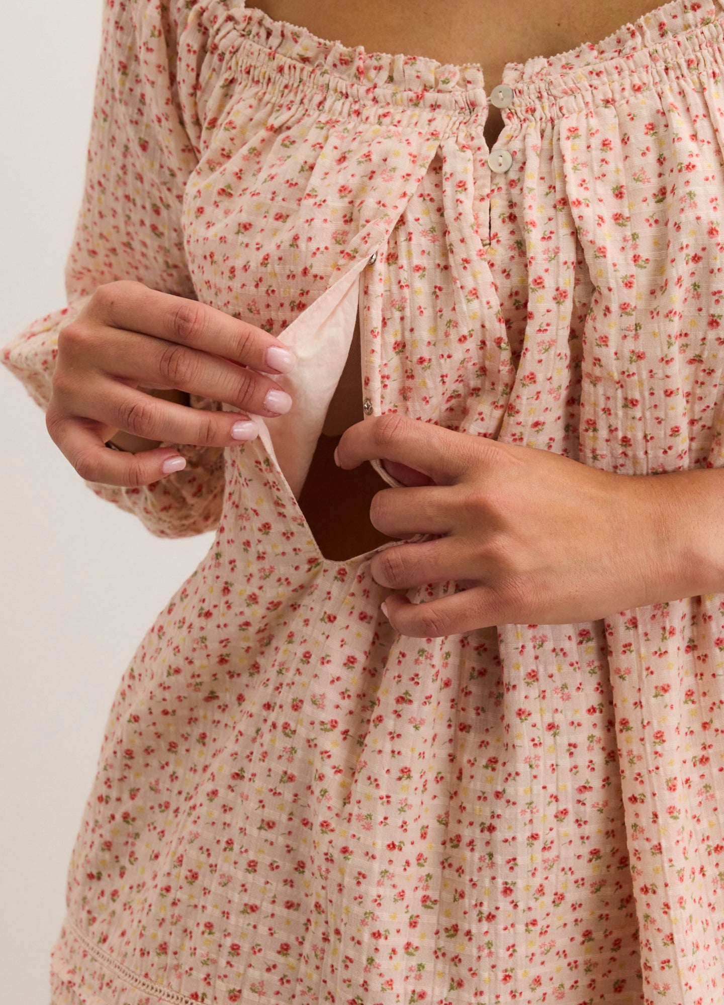 Pink floral maternity nursing dress with hidden side access and gathered neckline.