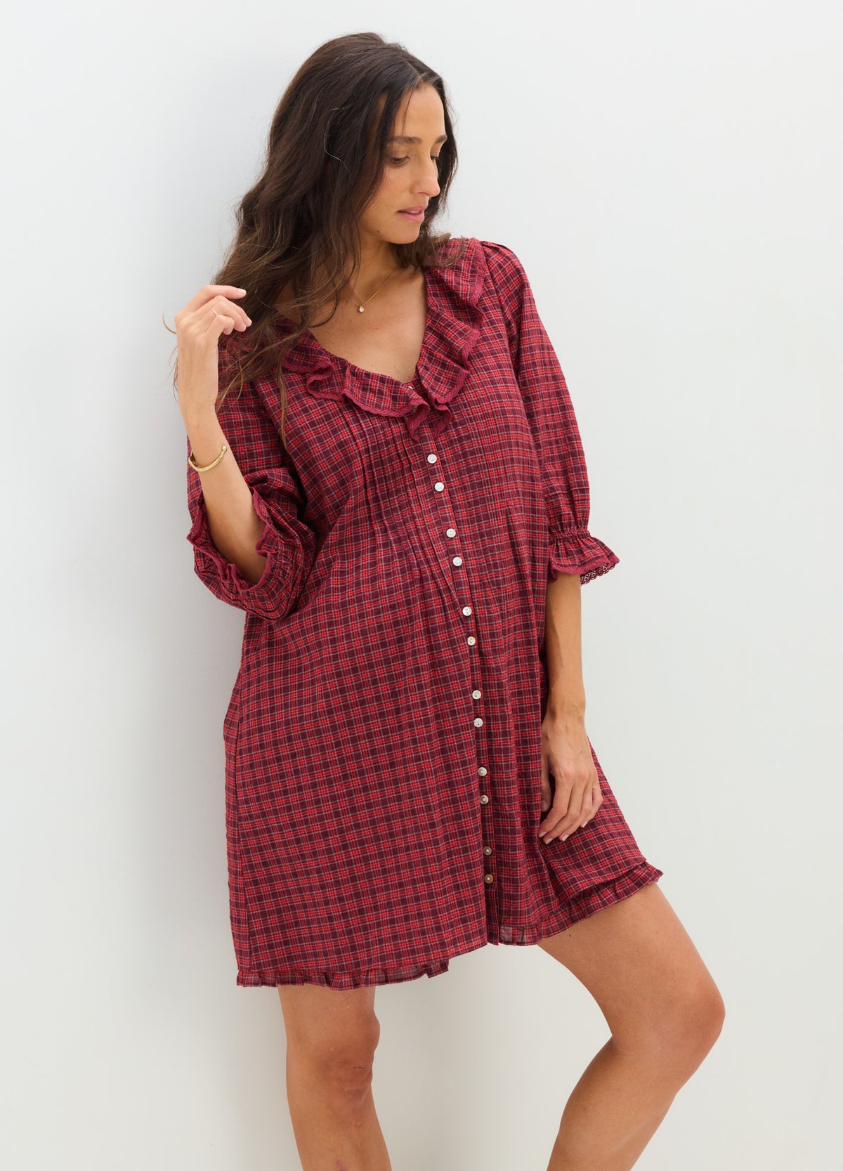 Red and black checked nursing mini dress with button front and 3/4 sleeves, loose fit for maternity comfort.