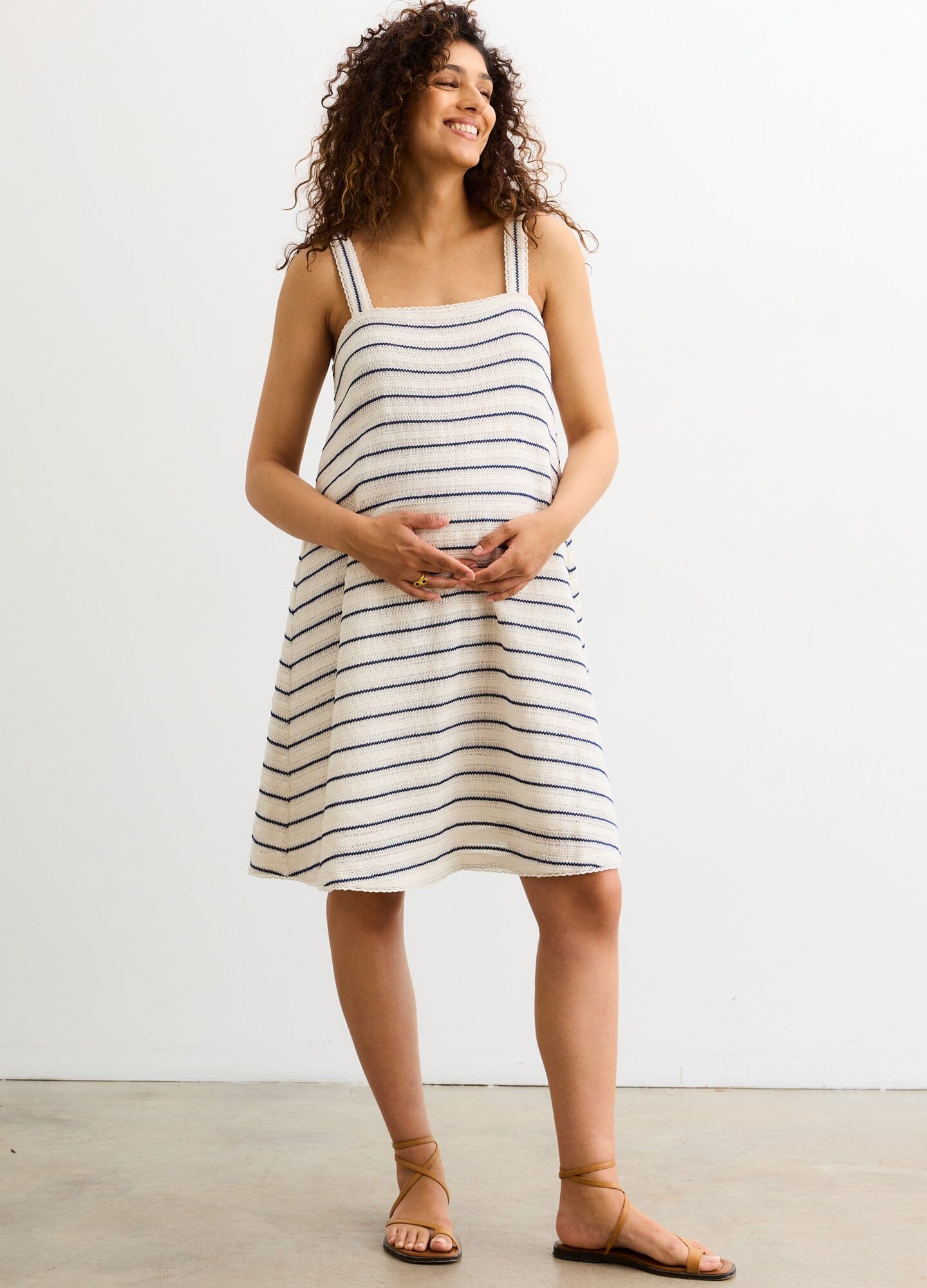 The Marianna Dress - Blue and white striped sleeveless maternity dress with adjustable straps, designed for pregnancy, nursing, and postpartum.