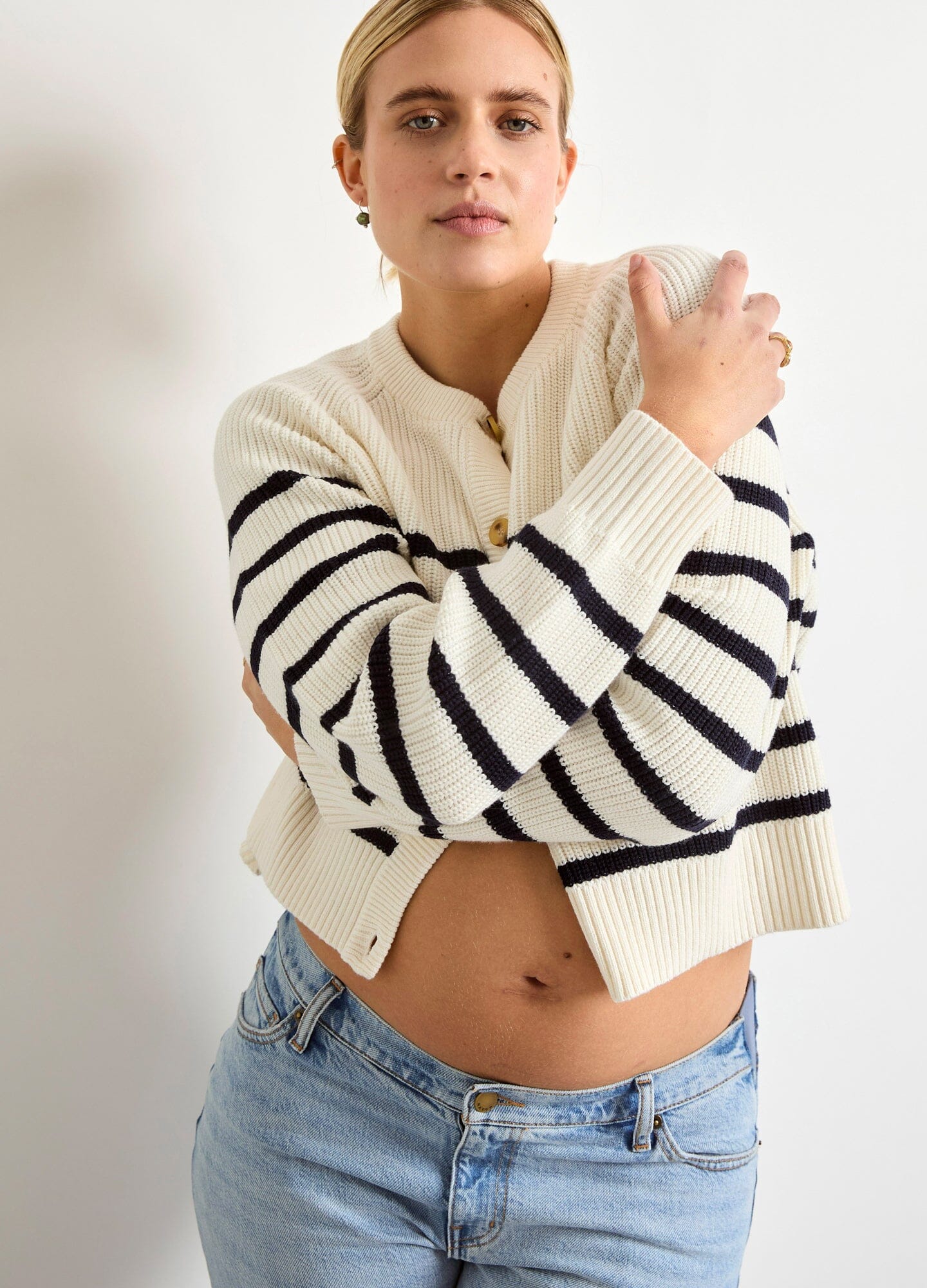 The Mini Cocoon Marlow Cardi - Ivory and navy striped knitted cardigan with button closure, long sleeves, designed for maternity, nursing, and postpartum.