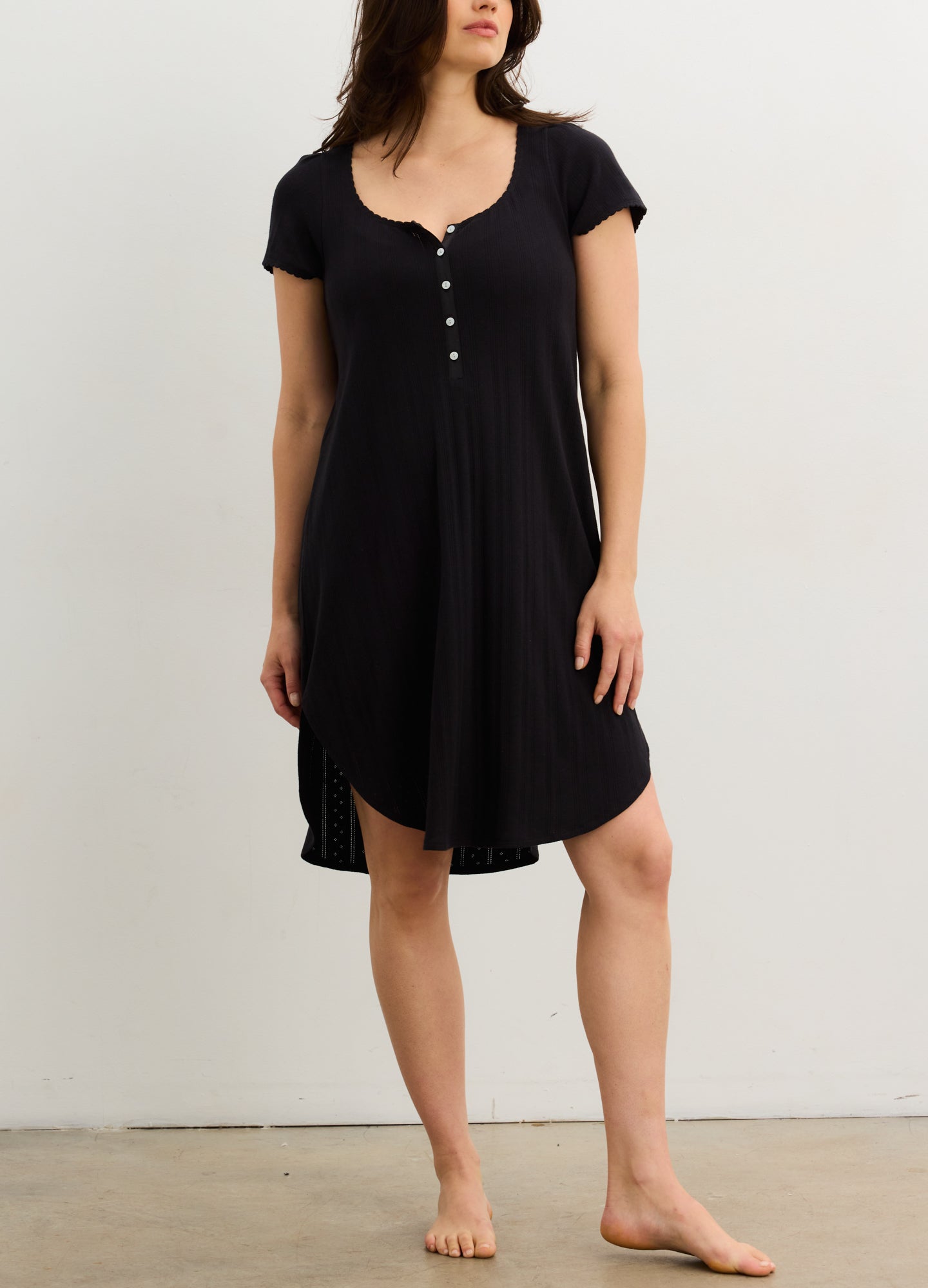 Black short-sleeve knee-length maternity nightgown with scoop neckline and button-down front.