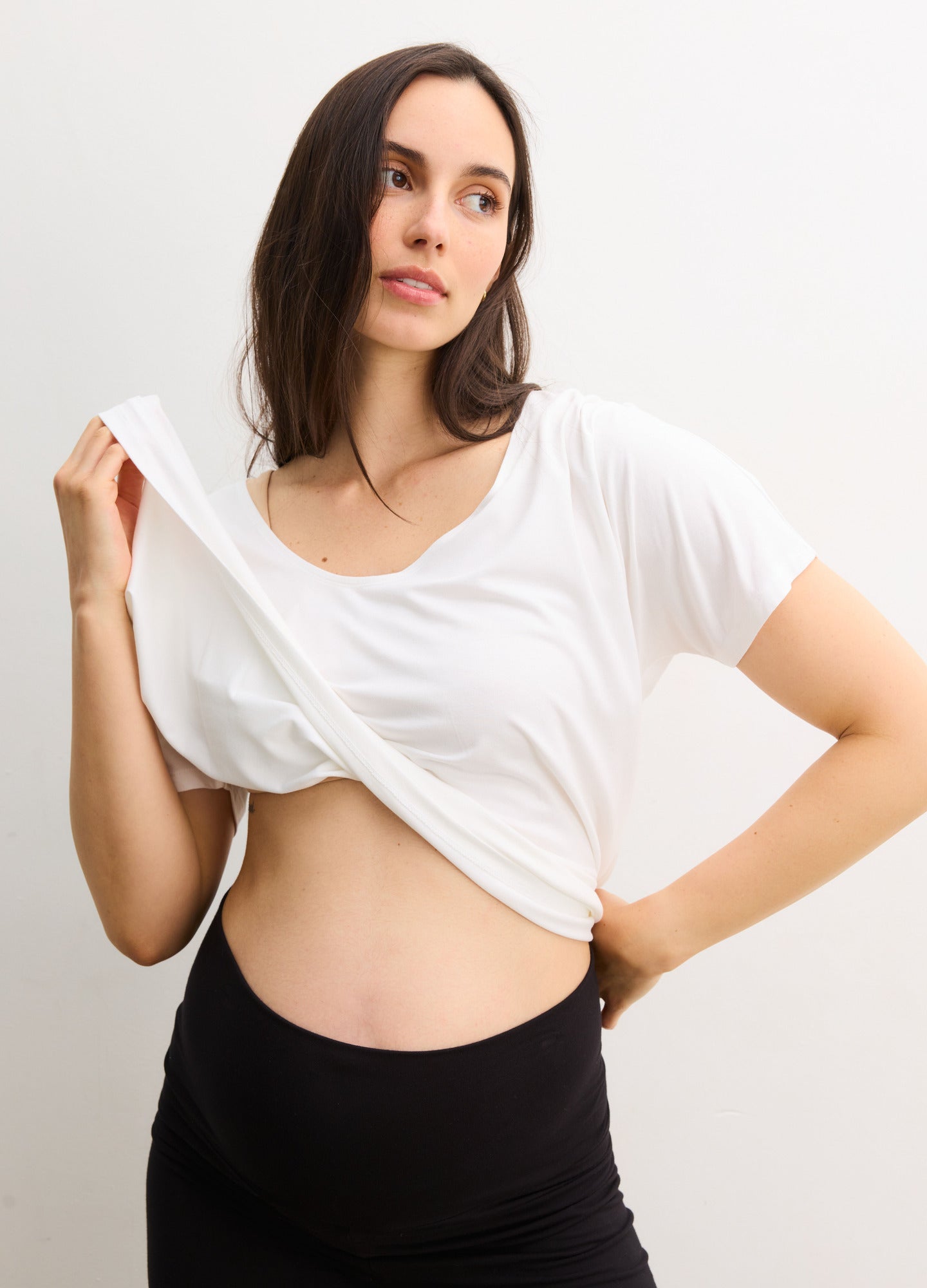 The Perfect Vee - White maternity V-neck top with short sleeves designed for pregnancy, nursing, and postpartum comfort.