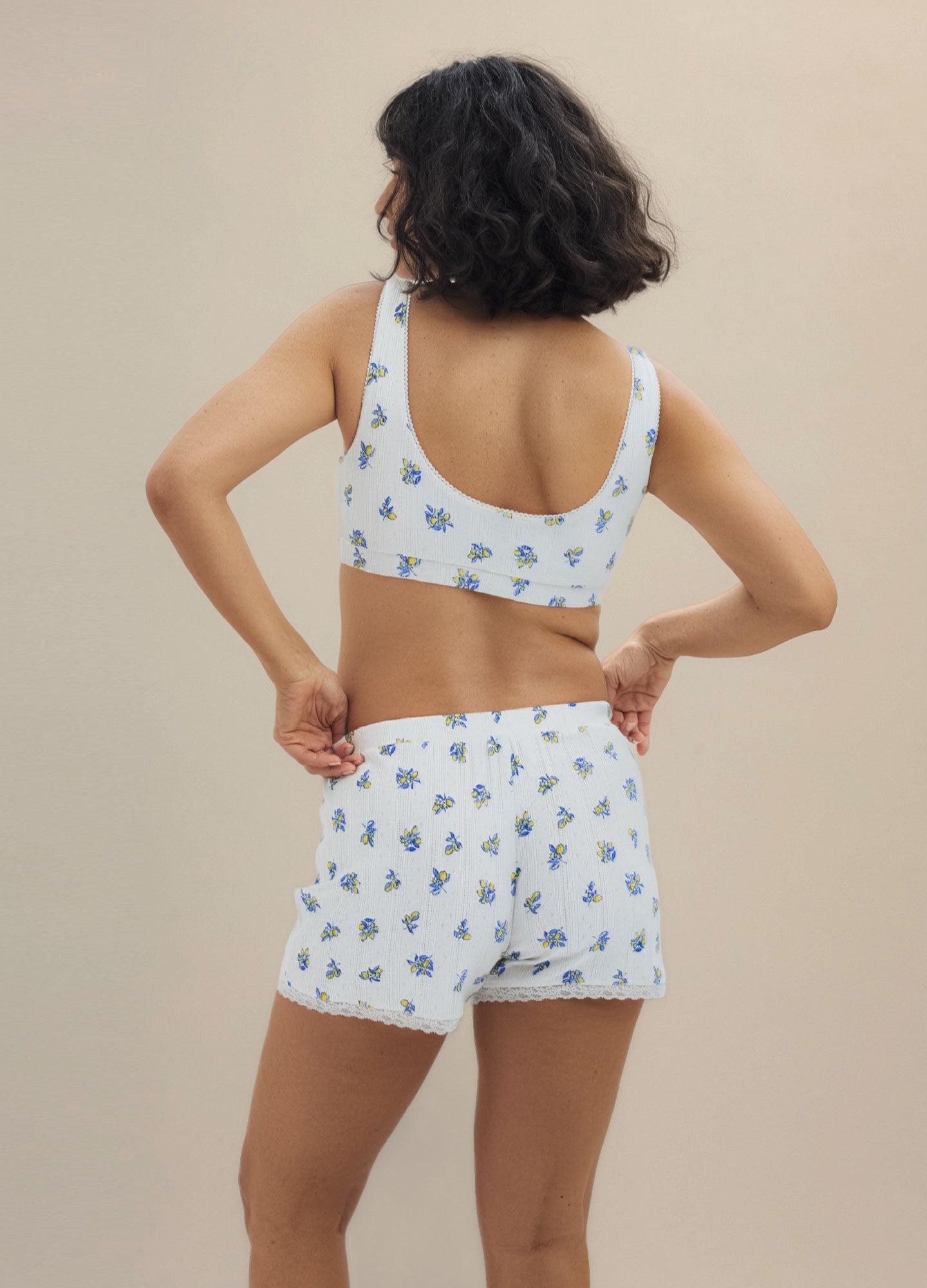Light blue maternity lounge shorts with elastic waistband and small floral print on soft fabric.