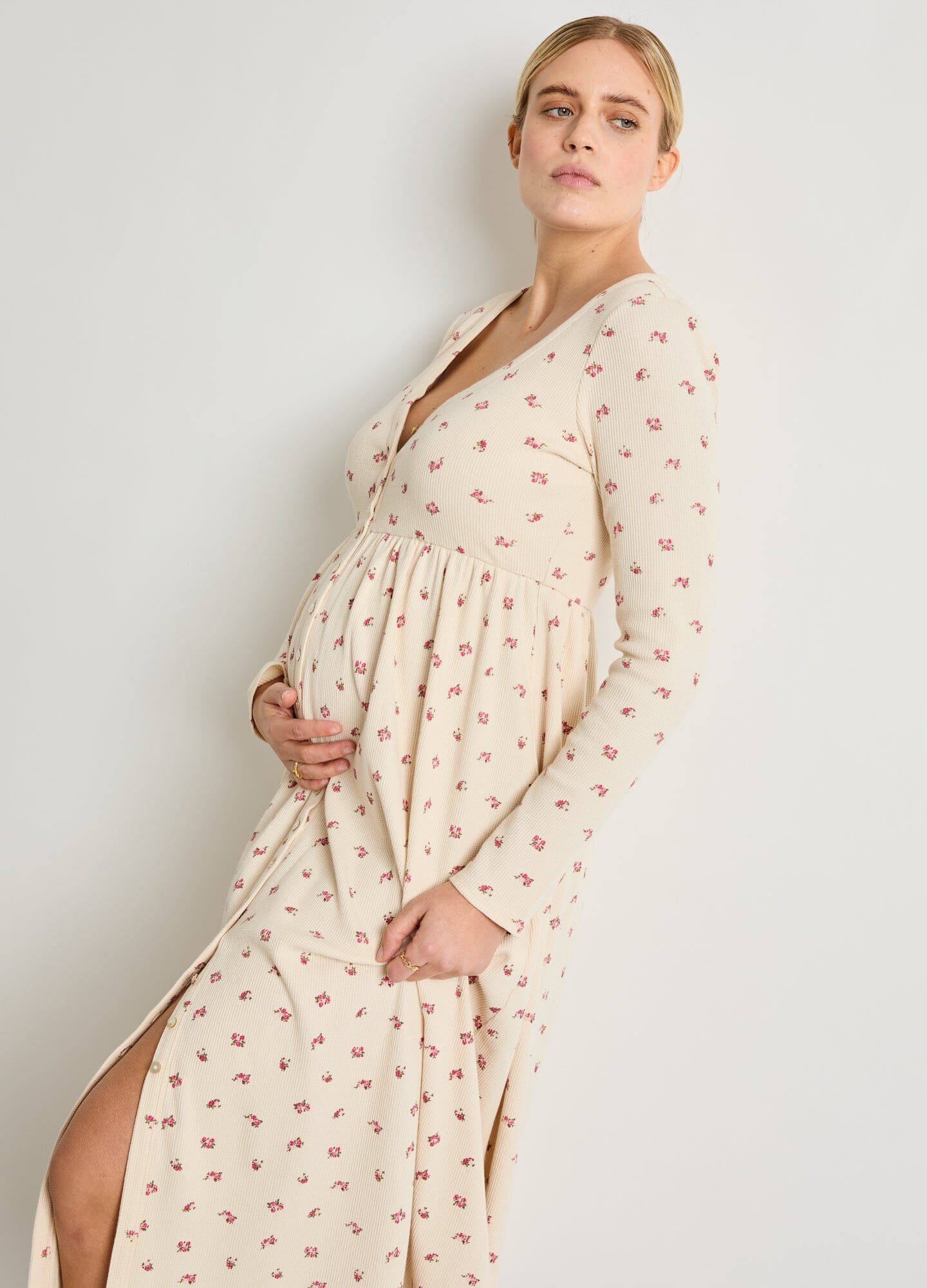 The Printed Waffle Nursing Dress - Cream waffle knit nursing dress with pink floral print, long sleeves, side slit, and V-neck, designed for maternity and.